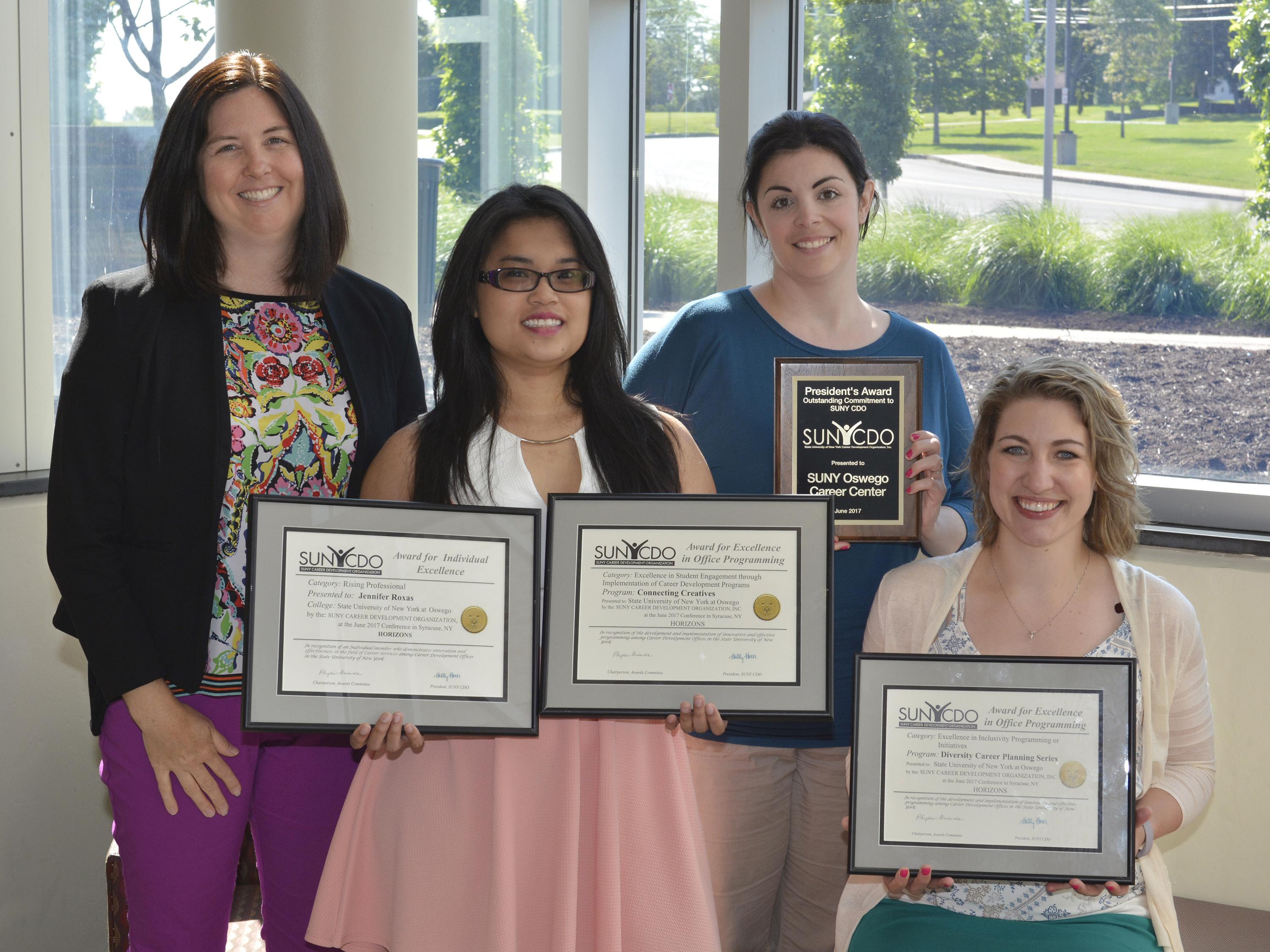 Career Services staff with awards