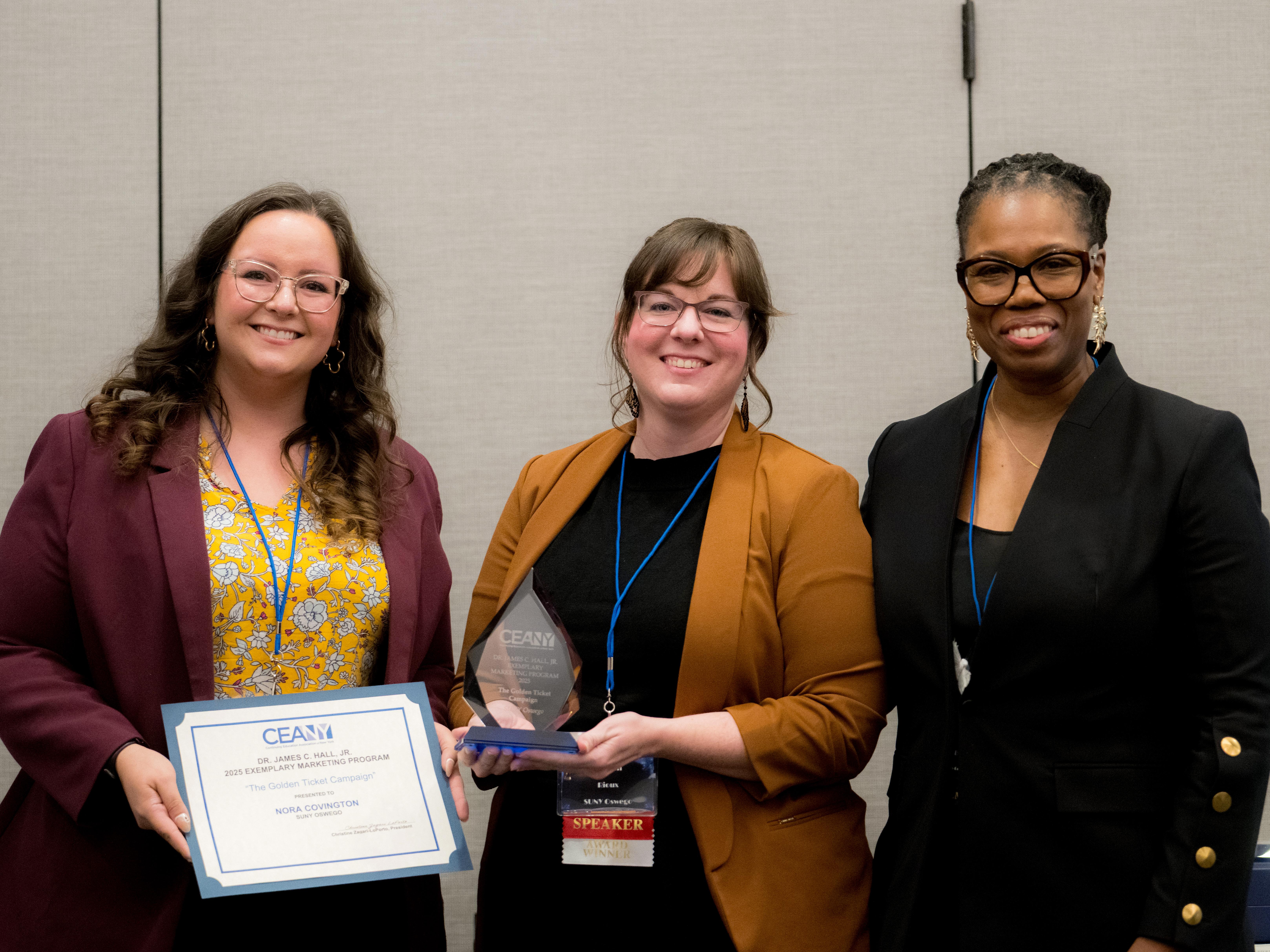SUNY Oswego Division of Extended Learning staffers accept Continuing Education Association of New York (CEANY) Exemplary Marketing Program Award
