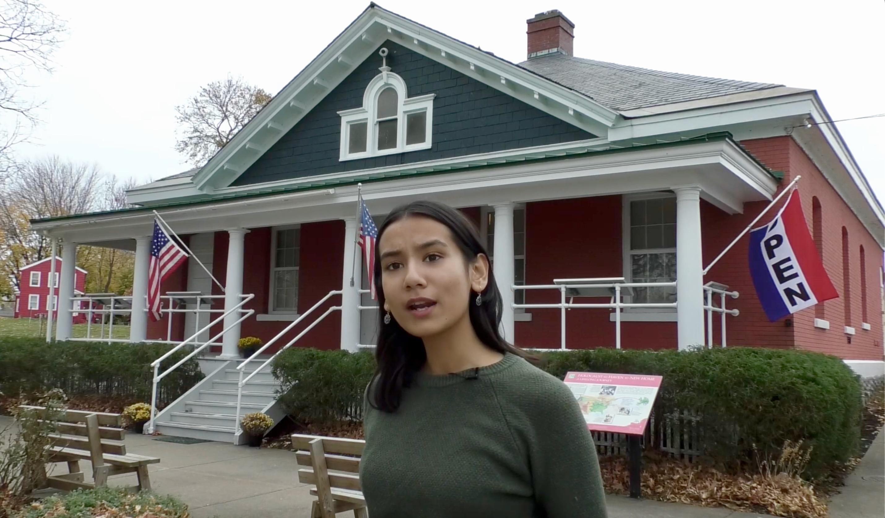 Senior broadcasting & mass communication major Clarissa Karki in front of the Safe Haven museum in Oswego.