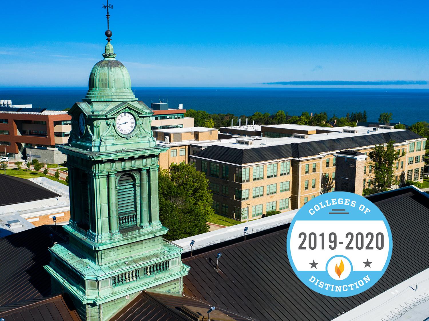 Aerial evening view of Sheldon Hall cupola with Colleges of Distinction logo