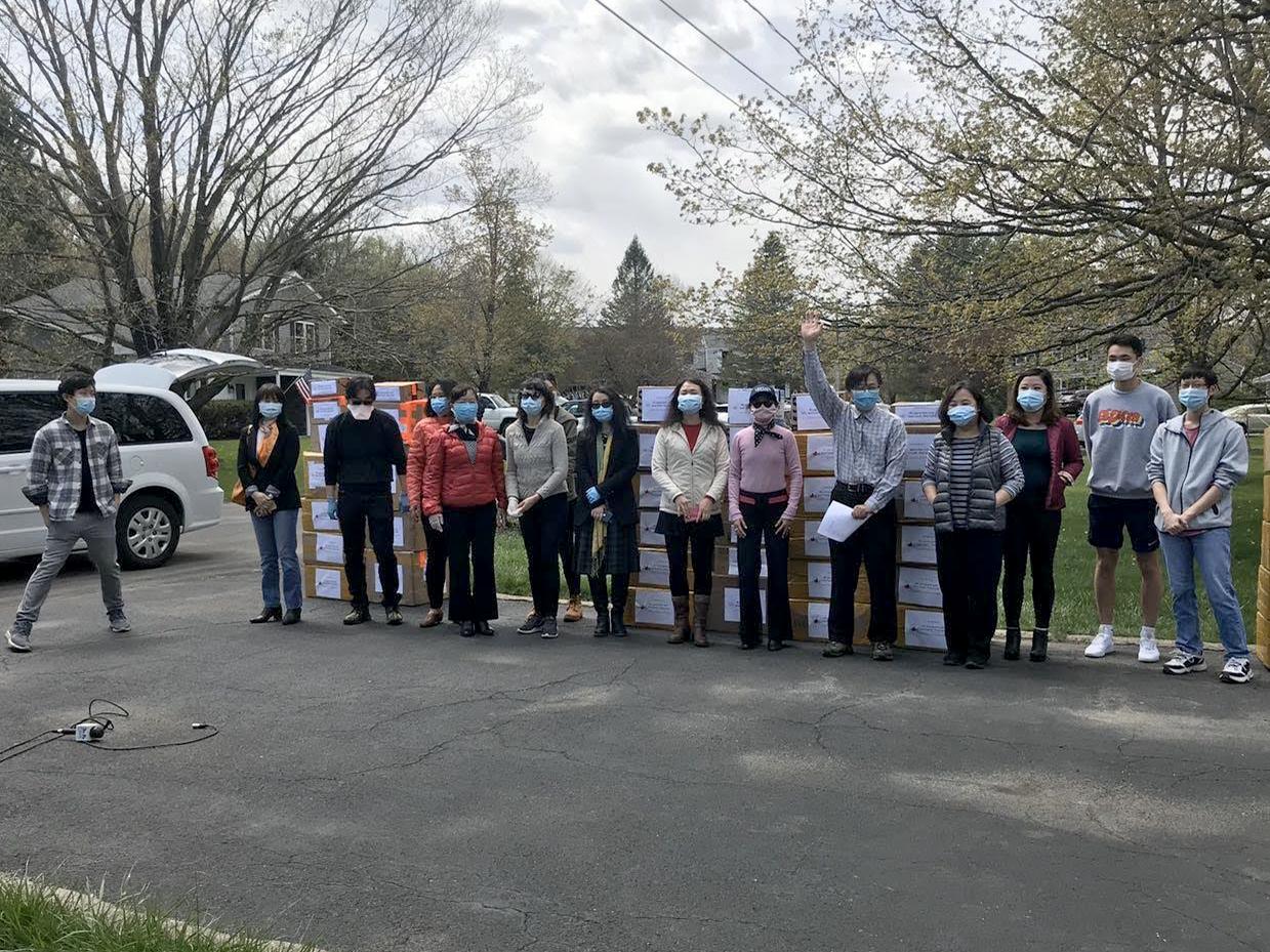 Members of the Chinese-American community with collected PPE which they donated across Central New York