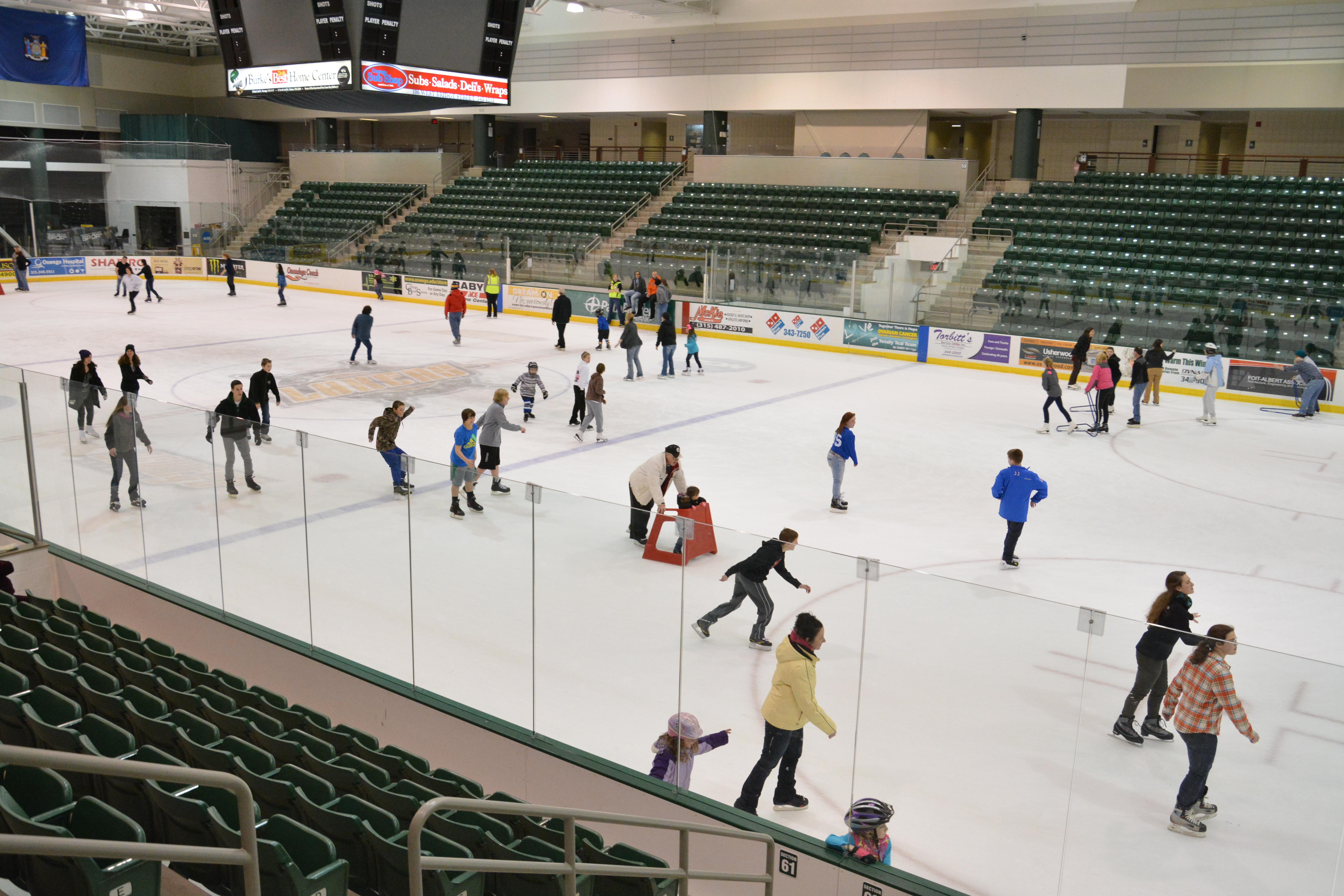 Young people ice skating in Marano Campus Center arena