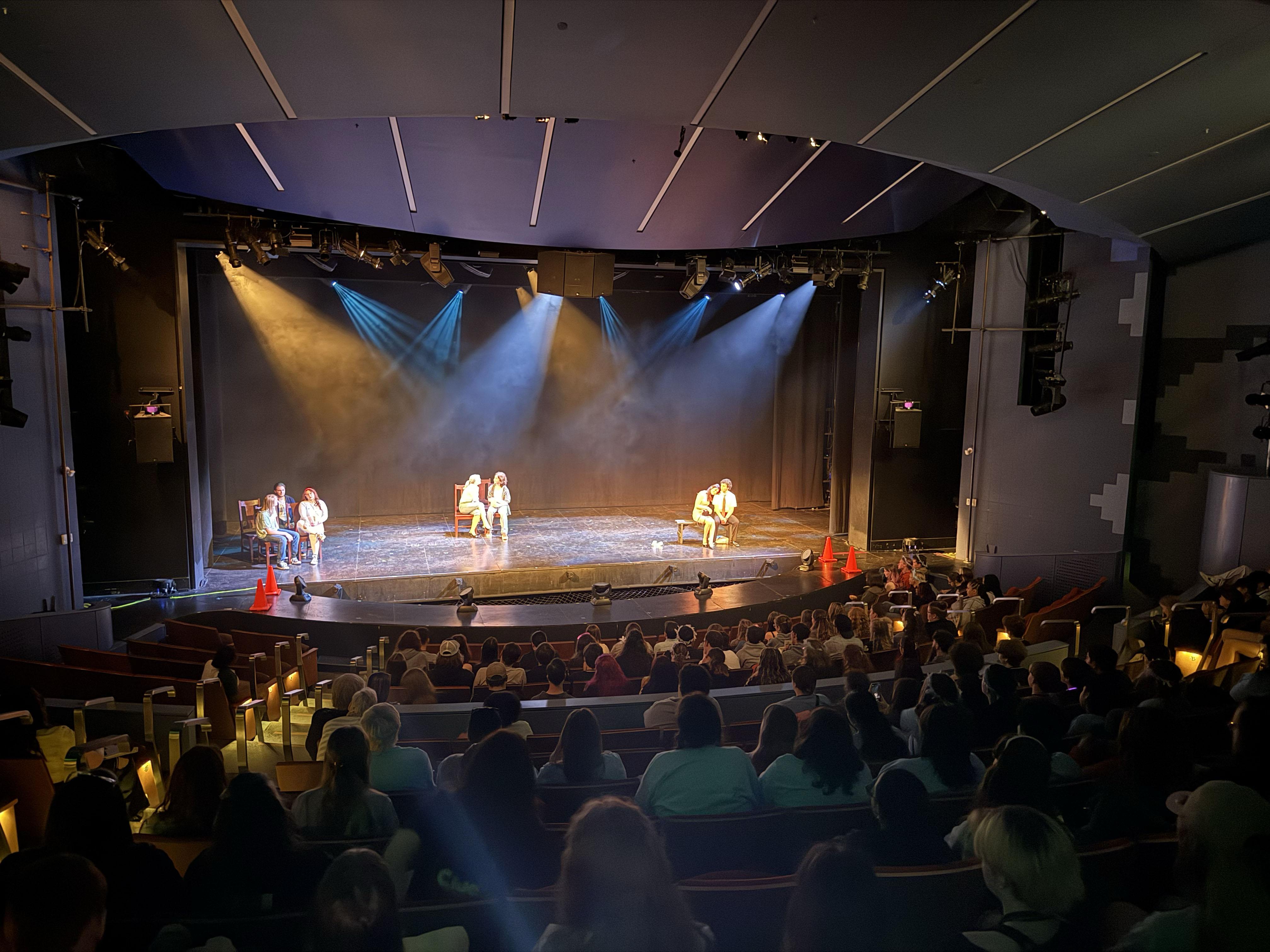 Hundreds of high school students take in a performance in Waterman Theatre during Dramafest