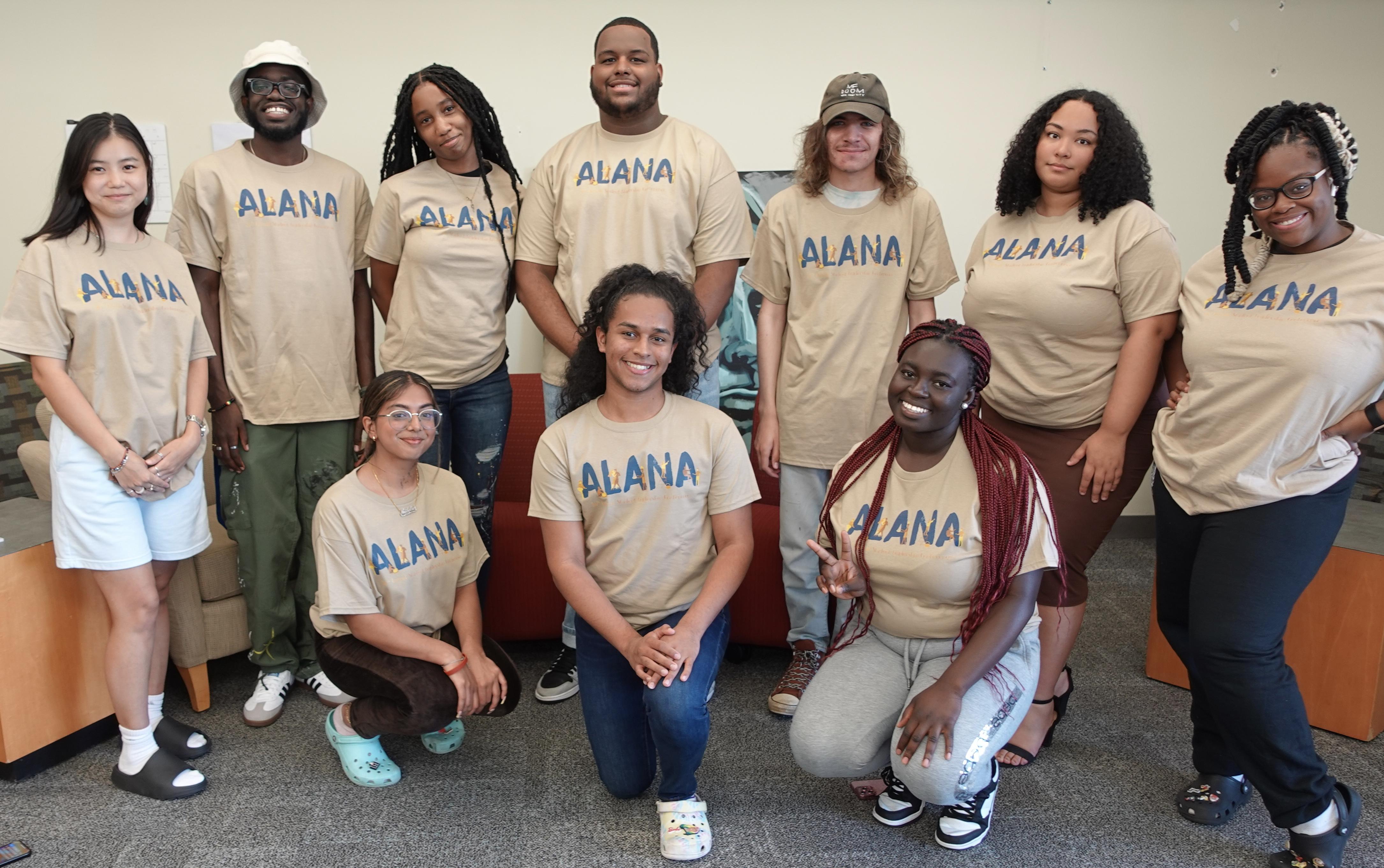 ALANA student leaders wearing tan ALANA conference shirts with blue and gold logo for the 36th annual conference themed Joyful Noise