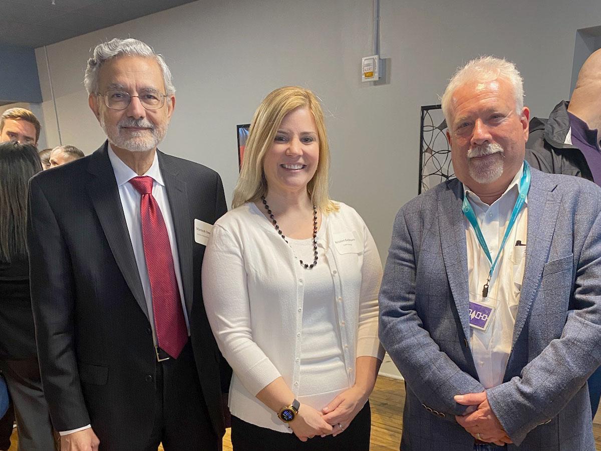 Kristen Eichhorn is welcomed as an advisory board member for the CNY Biotech Accelerator by Mantosh Dewan, president of Upstate Medical University (at left), and David Amberg, vice president for research at Upstate Medical University. 