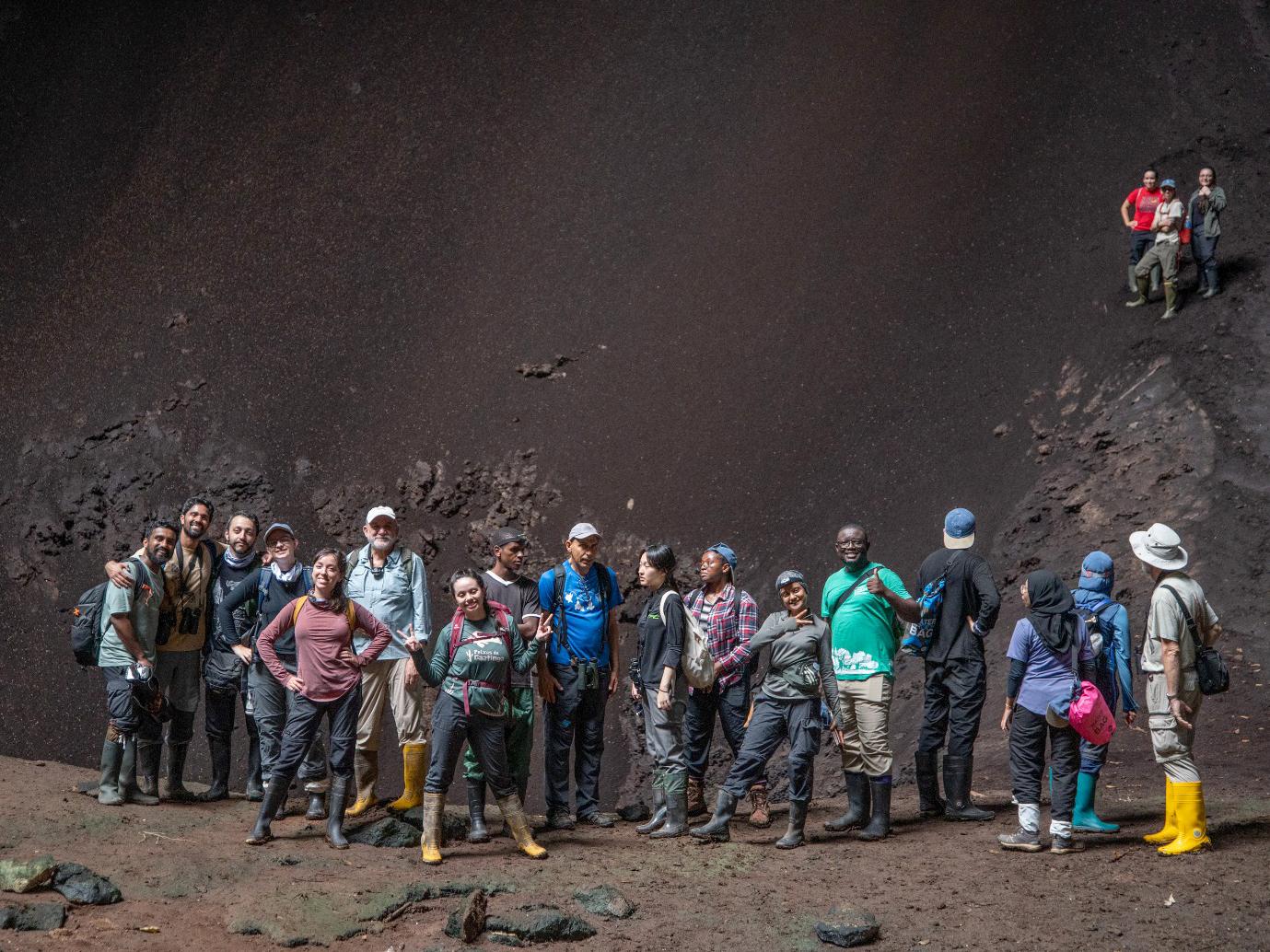 Bat researchers exploring a cave as part of the inaugural Global South workshop