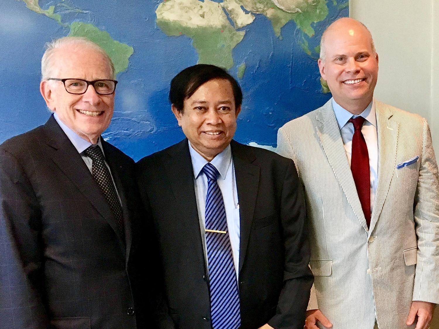 Allan Goodman (left), president of the Institute for International Education, meets in his New York City office with Joshua McKeown, director of international education and programs at SUNY Oswego, and Dr. Myint Oo, physician and educator from Myanmar