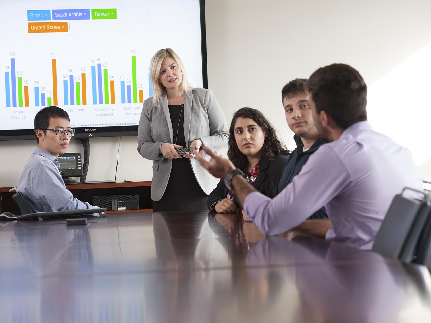 Dean Kristen Eichhorn speaks with graduate students