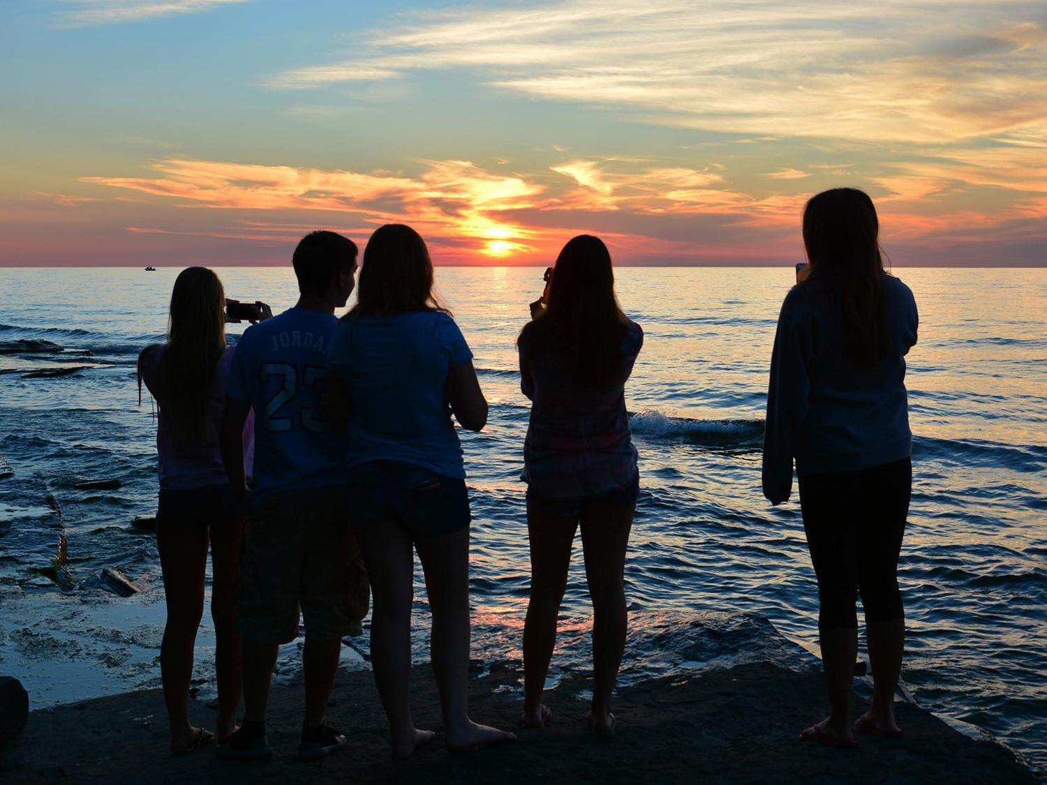 Students taking photos of Lake Ontario