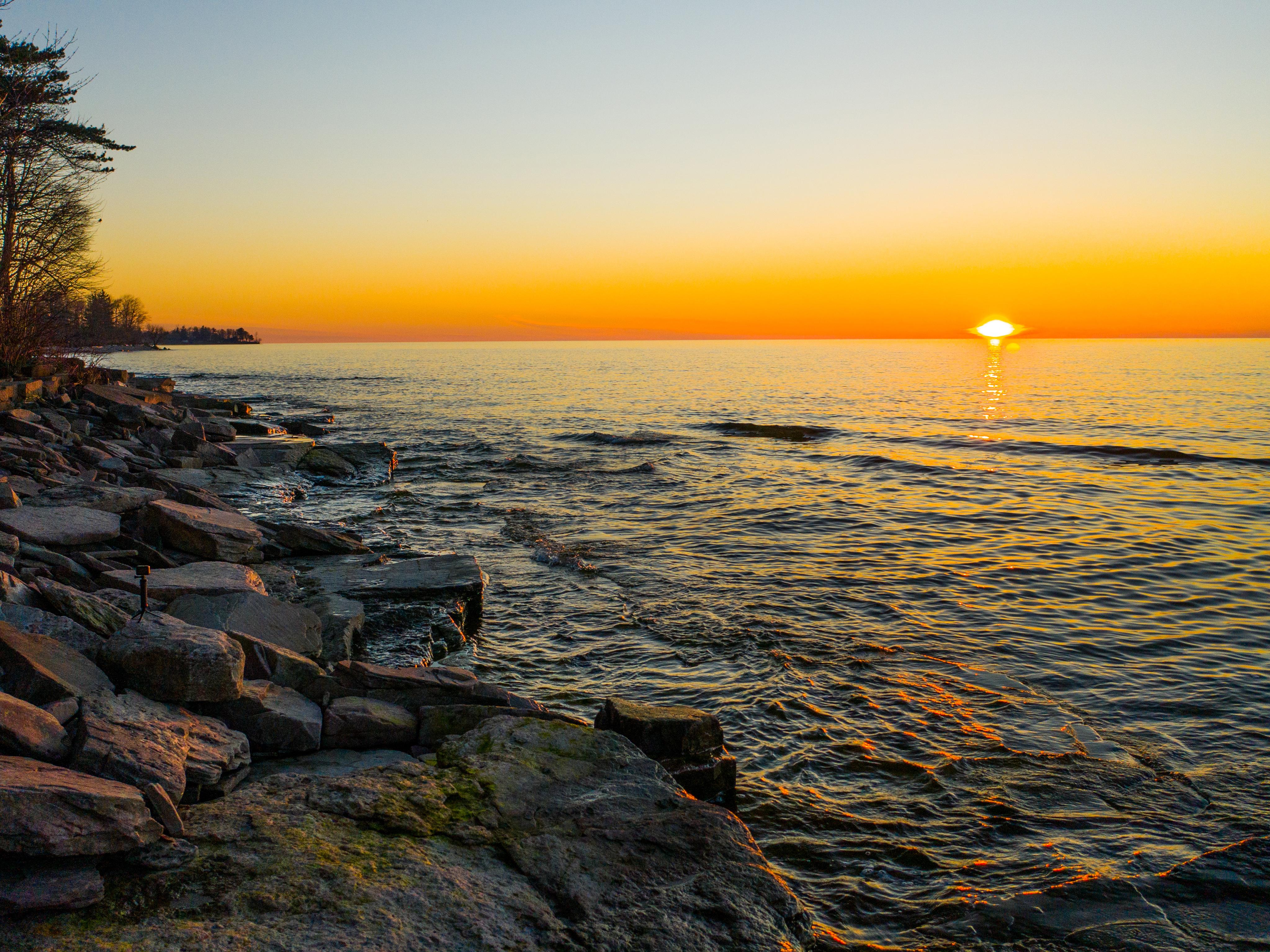 A Lake Ontario sunset paints a variety of hues across the sky
