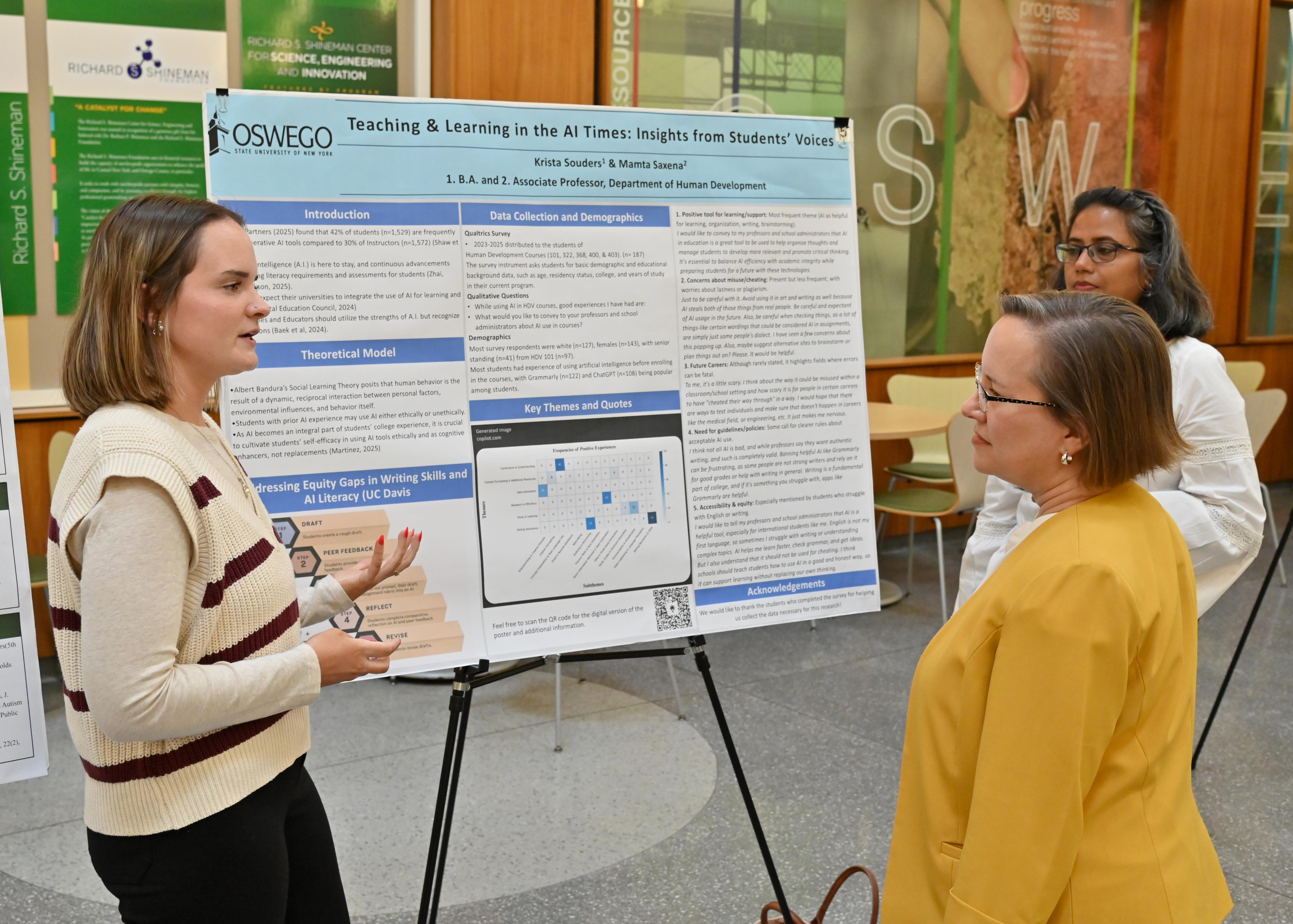 Senior human development major Krista Souders presents her research poster “Teaching and Learning in the AI Times: Insights From Students’ Voices” at the university’s Fall Poster Symposium to Kristin Croyle 