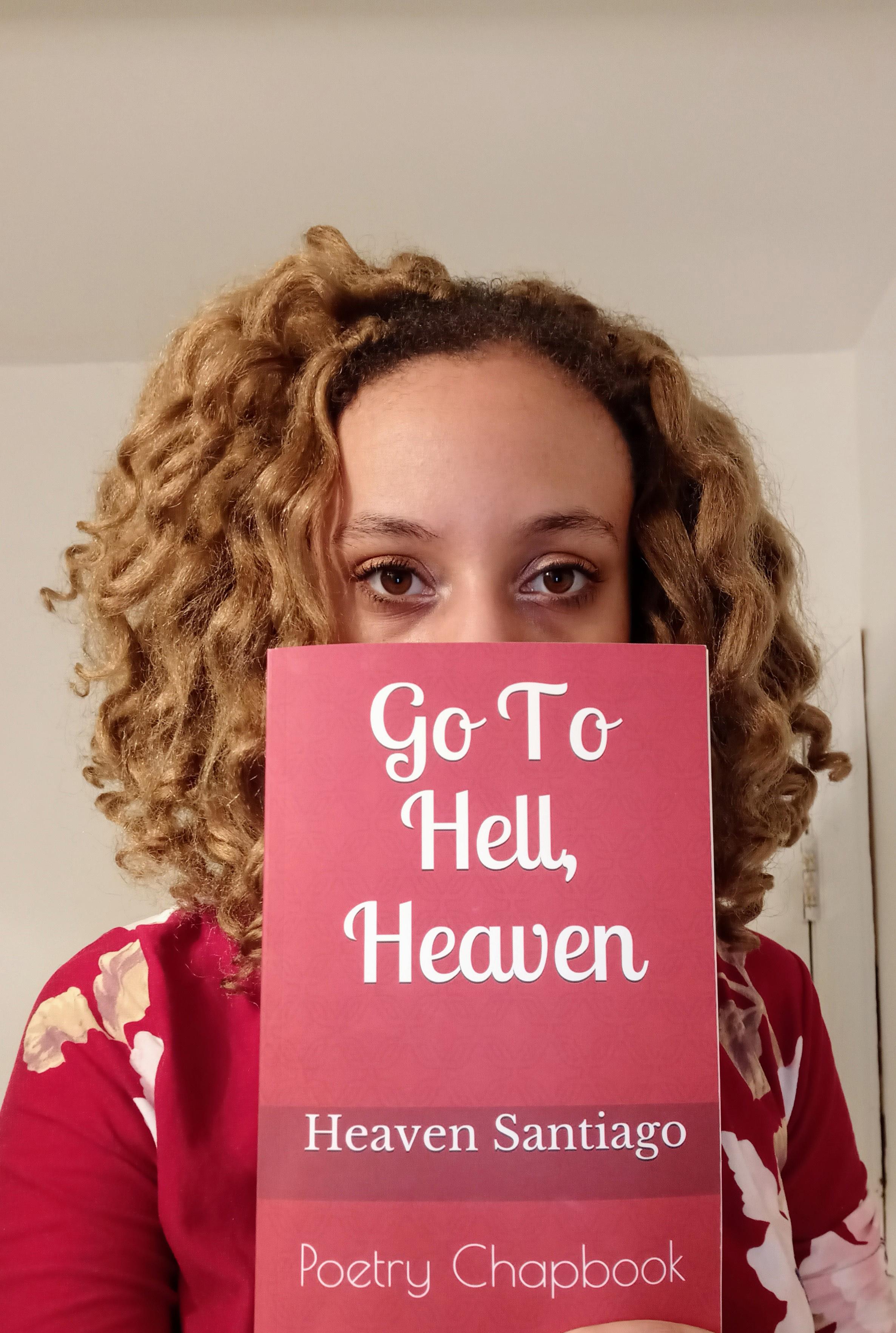 Heaven Santiago with her book of poetry, Go To Hell, Heaven