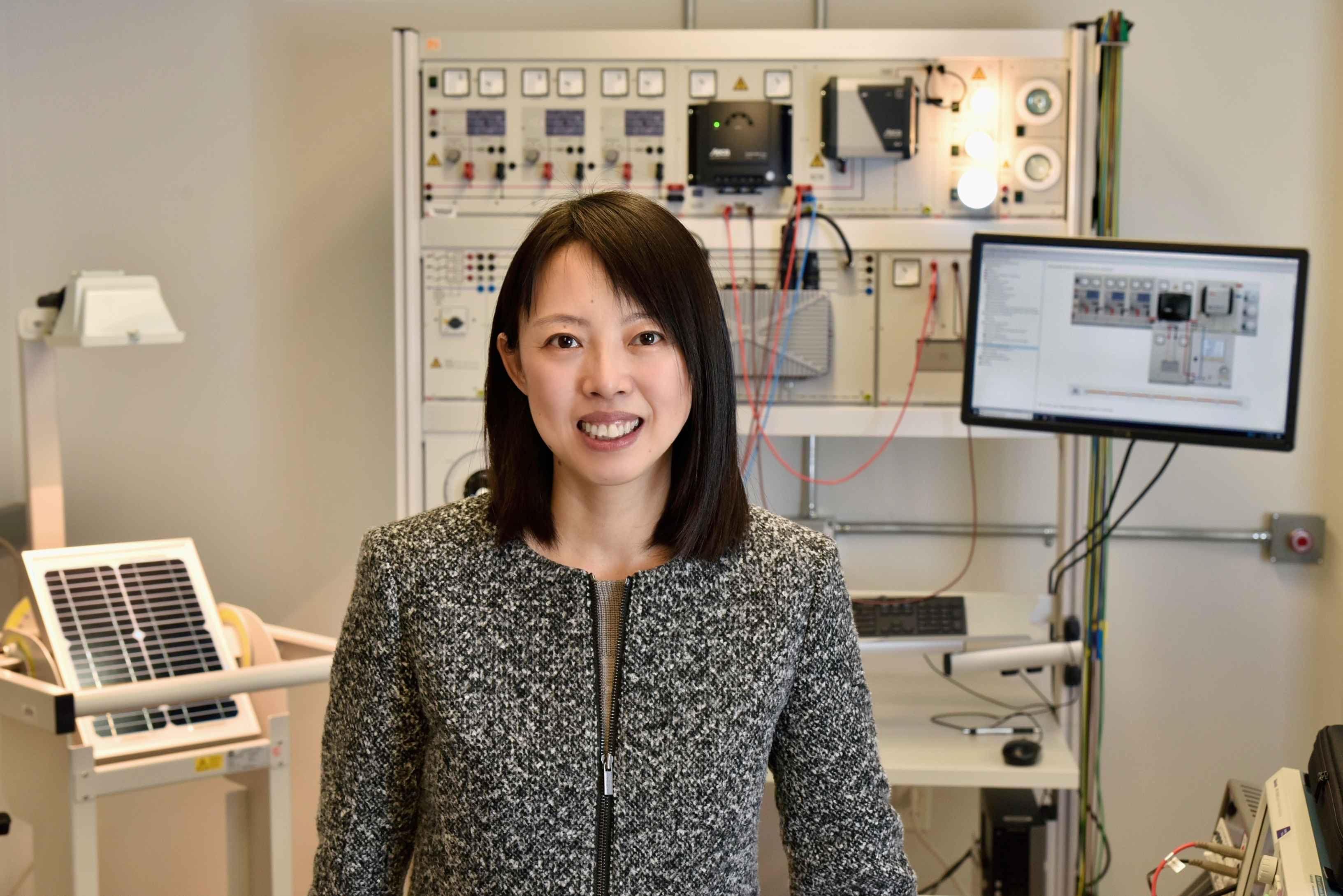 Professor Hui Zhang in lab with computer science and engineering equipment