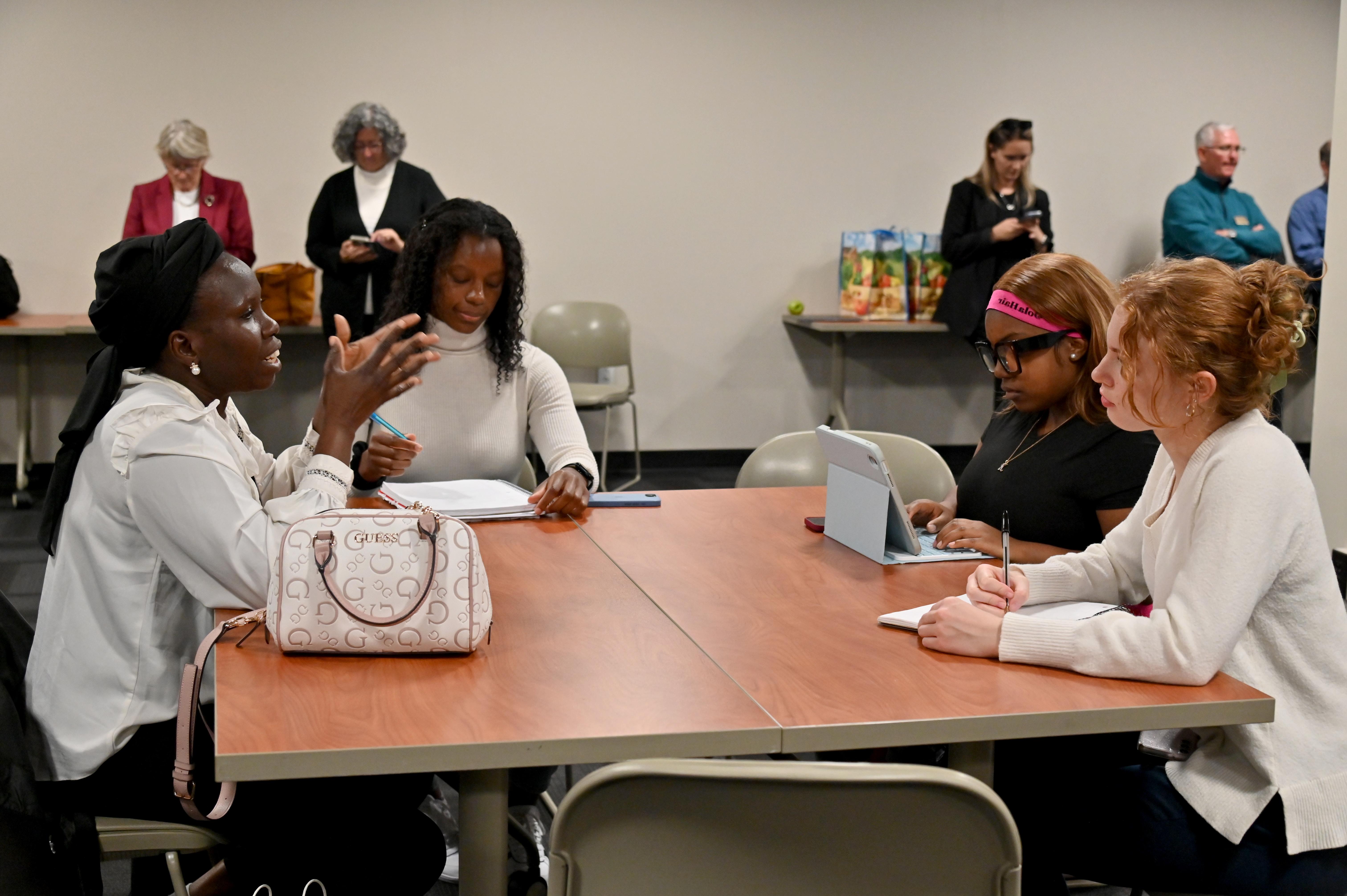 Humphrey Fellows representatives visit with members of SUNY Oswego's Cultural Environment of International Business class