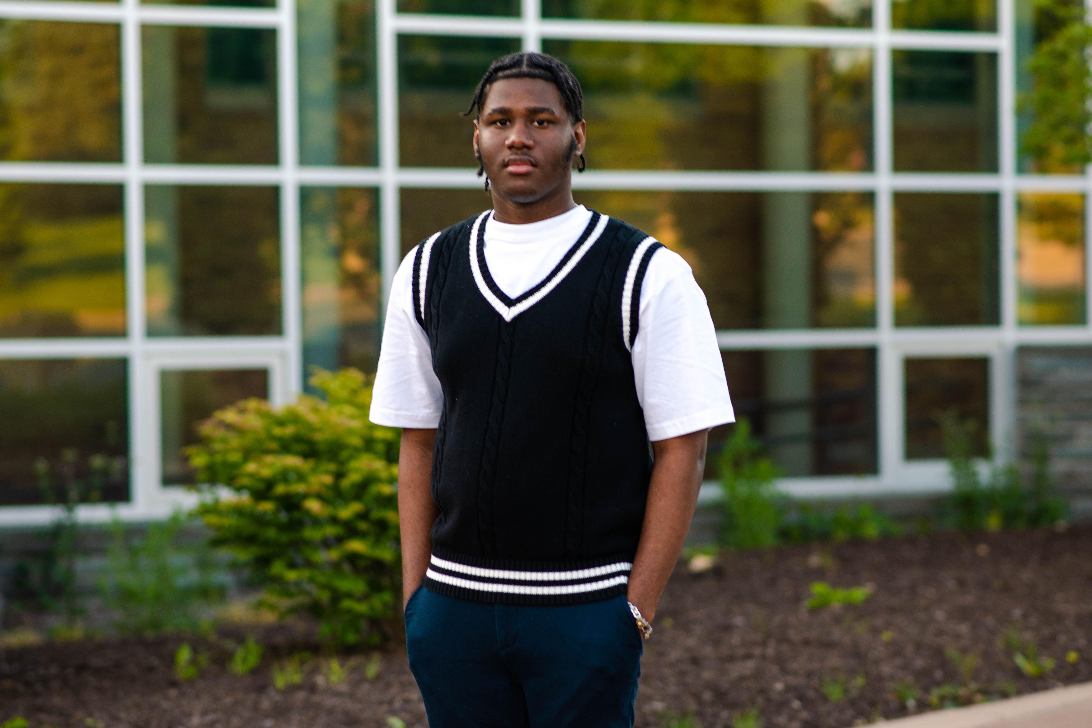 SUNY Oswego student Aiden Wilson stands in front of Marano Campus Center.