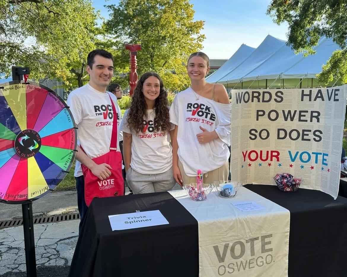 Sydney Mayer (center) tables with her peers for POL: 386: Vote Oswego.