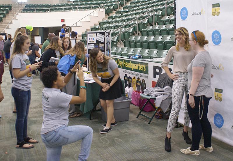 It's On Us/It's On Oz students work photo booth at Student Involvement Fair