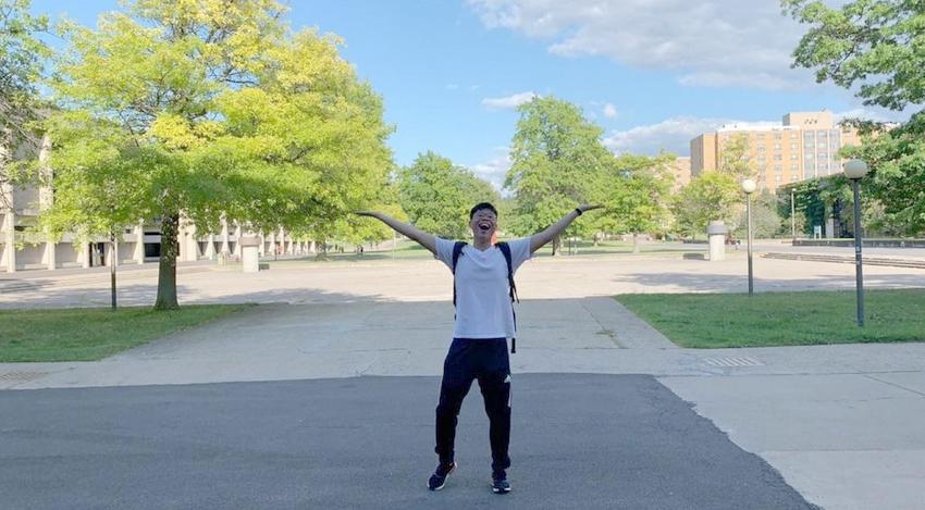 Johnson Liu, a junior computer science major from Brooklyn, shows his love for the campus