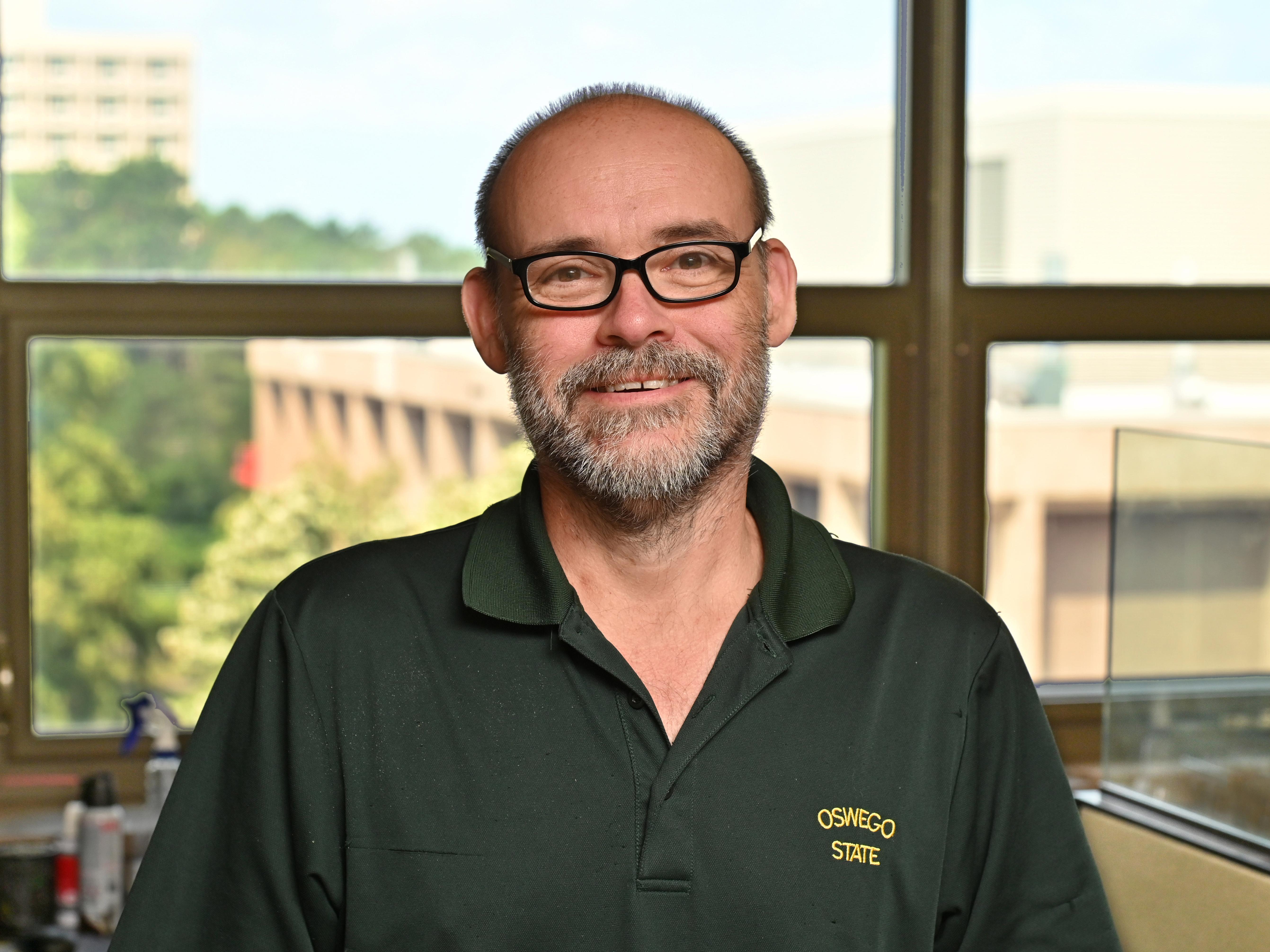 John-Jay Grass of the Student Accounts Office earned the Chancellor's Award for Excellence in Classified Service