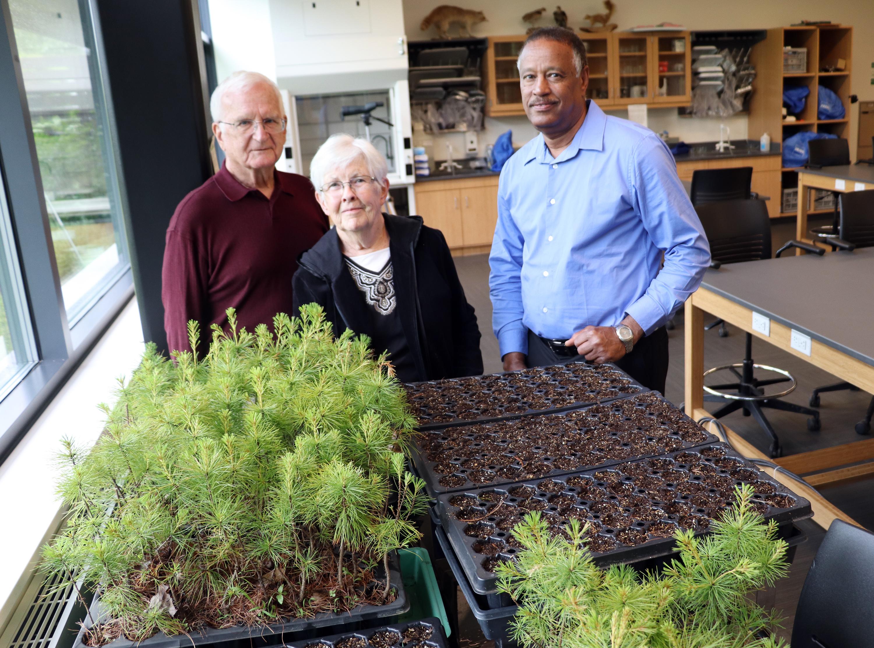 Arizona residents and New York state canal system boaters George and Jane Pauk join SUNY Oswego's Kamal Mohamed in a lab at Rice Creek Field Station