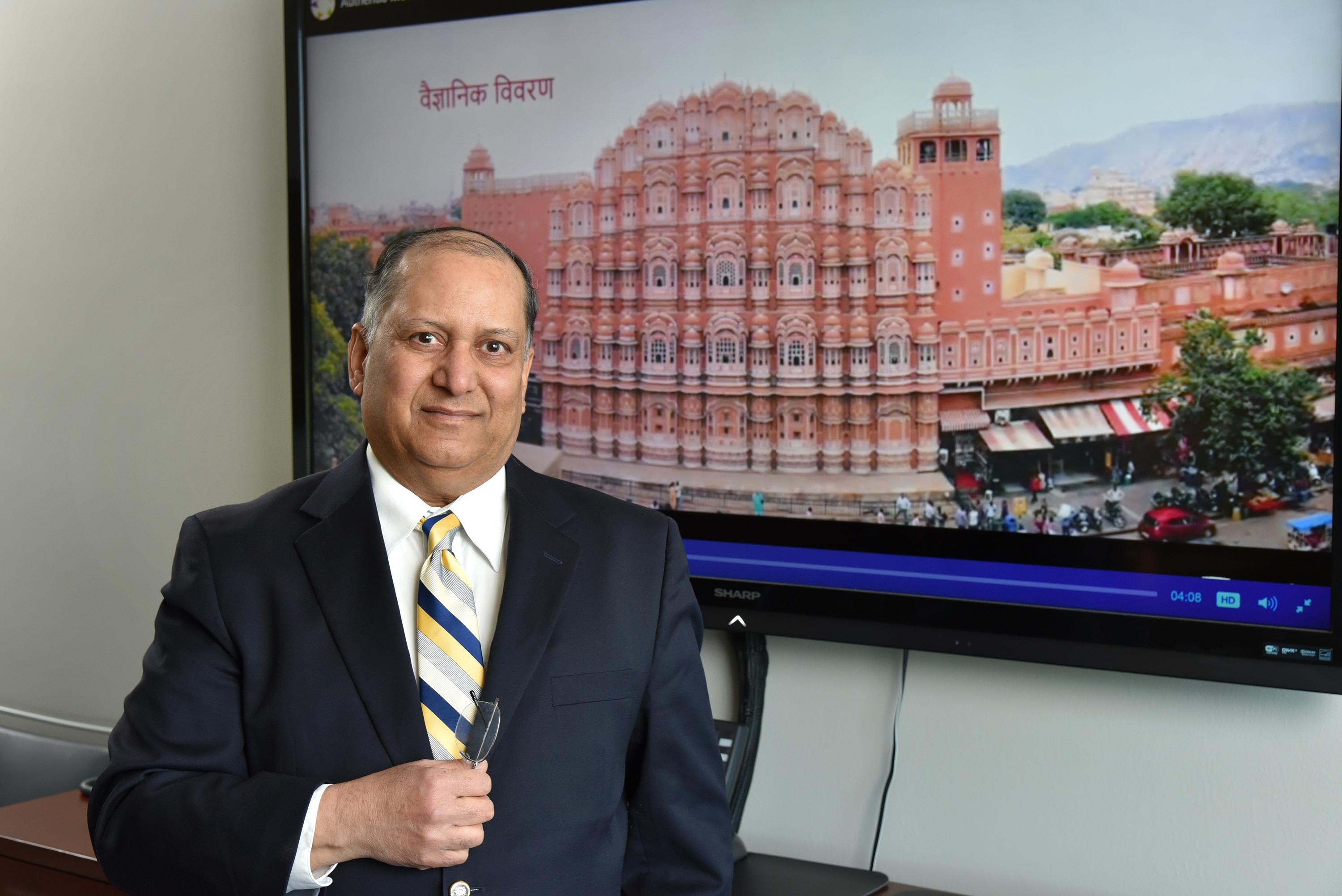 Alok Kumar with still of video he produced, this showing Hawa Mahal in Jaipur, a honeycomb structure built in 1799 that employs the Venturi effect for natural air conditioning