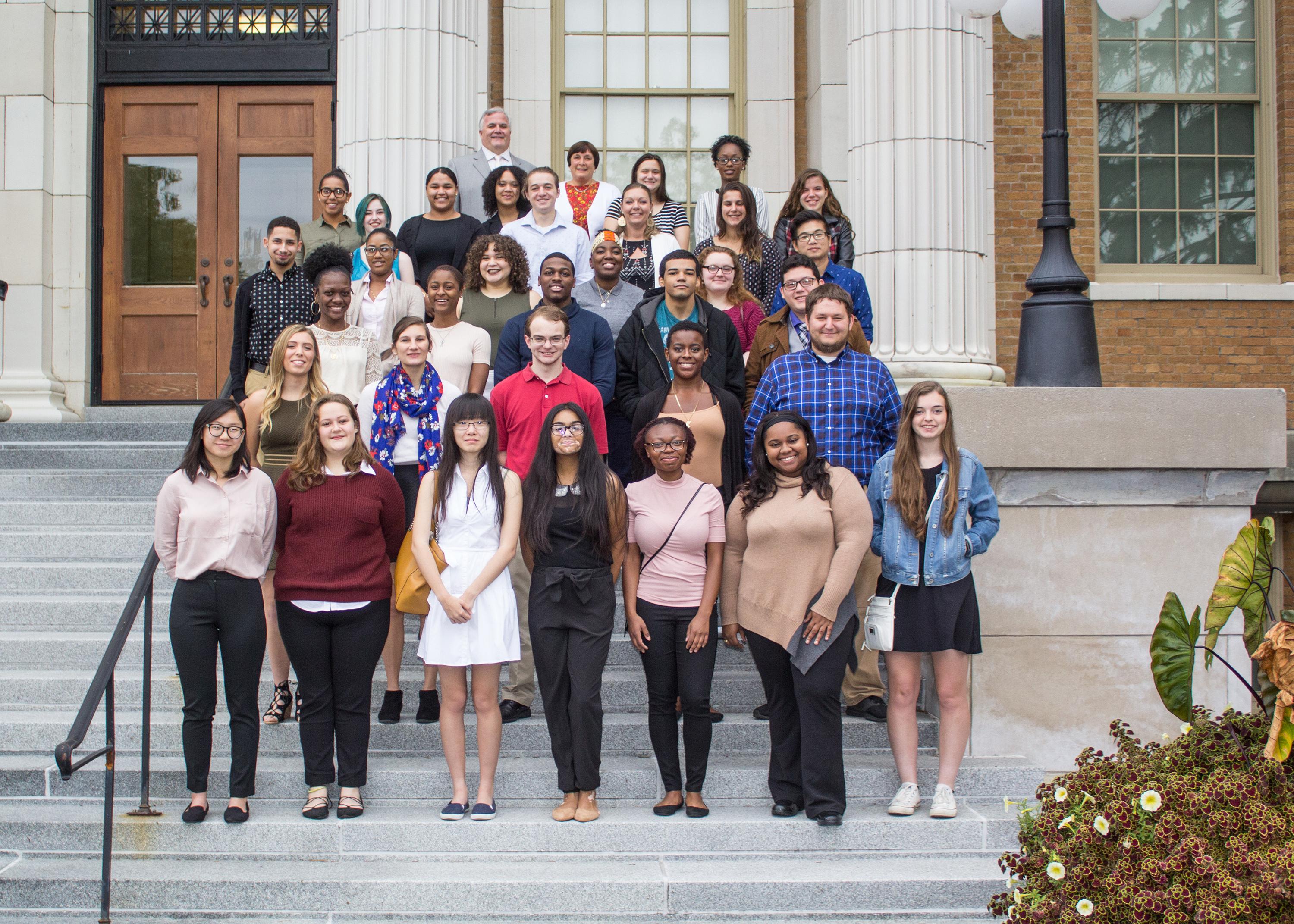 Students earning Marano Scholarships on steps of Sheldon Hall