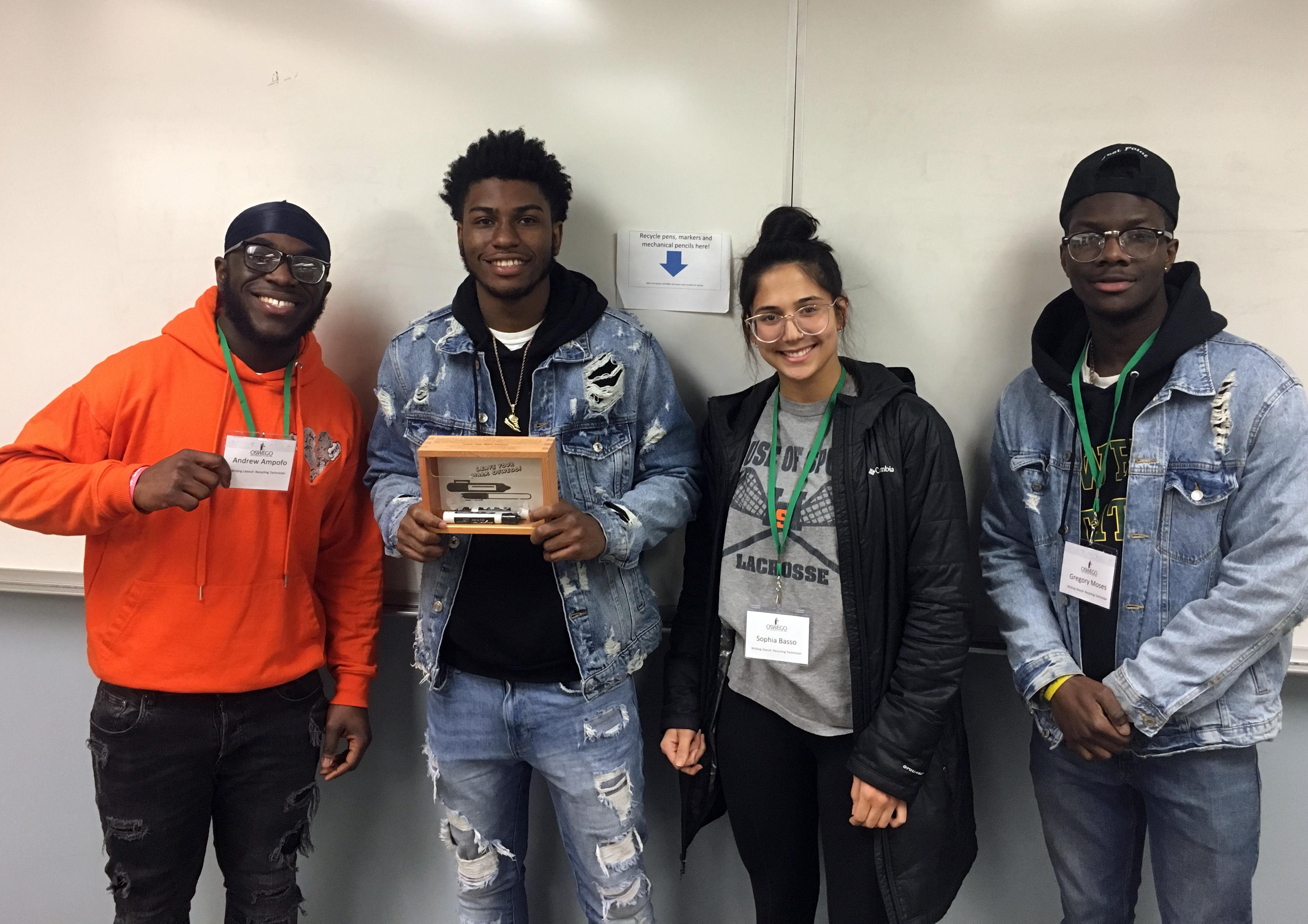 Student team distributes boxes to classrooms for recycling writing utensils