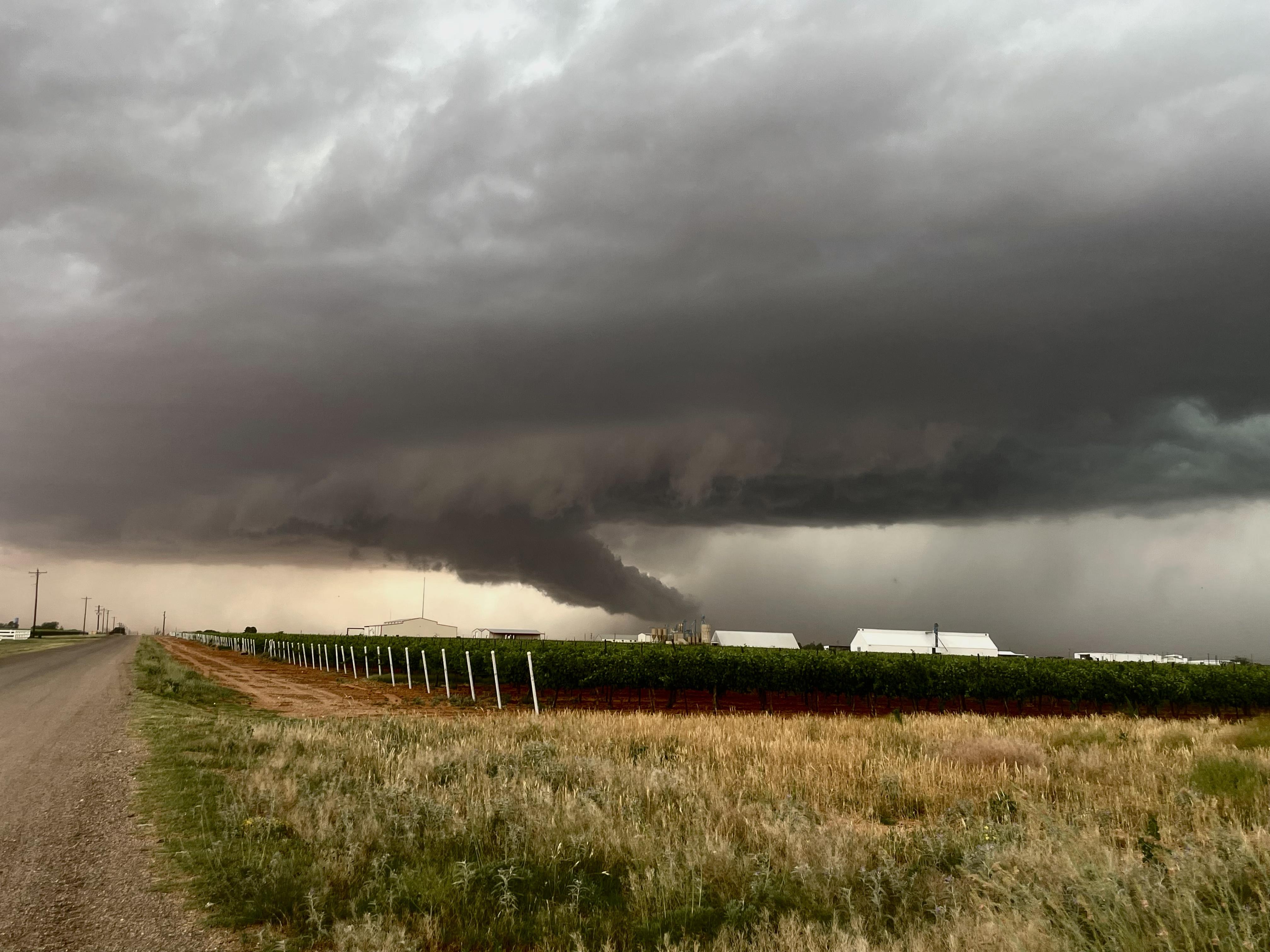 A funnel begins to form in a massive supercell near Brownfield, Texas