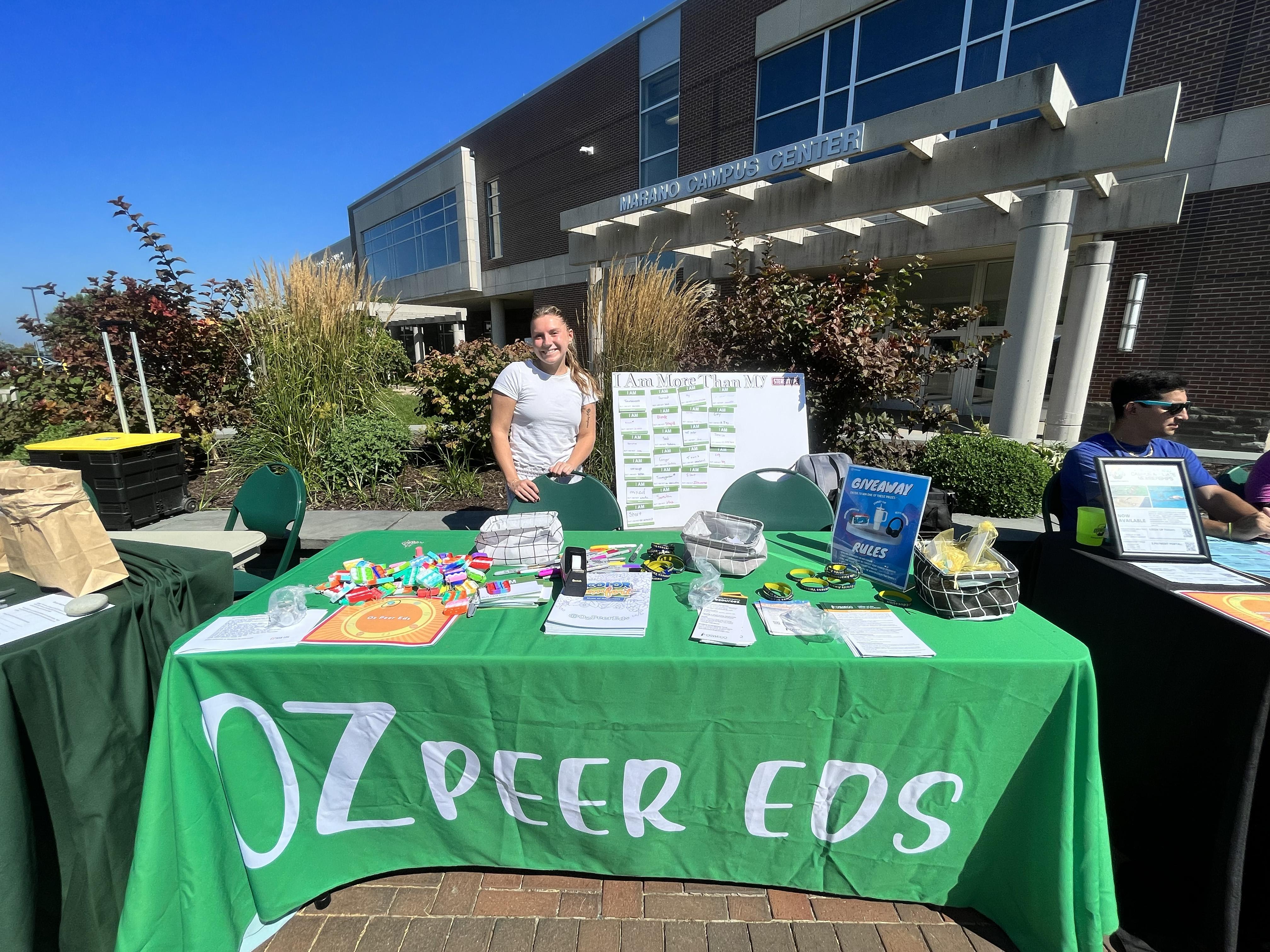 The Oz Peer Eds work a table at a previous Mental Health and Wellness Fair
