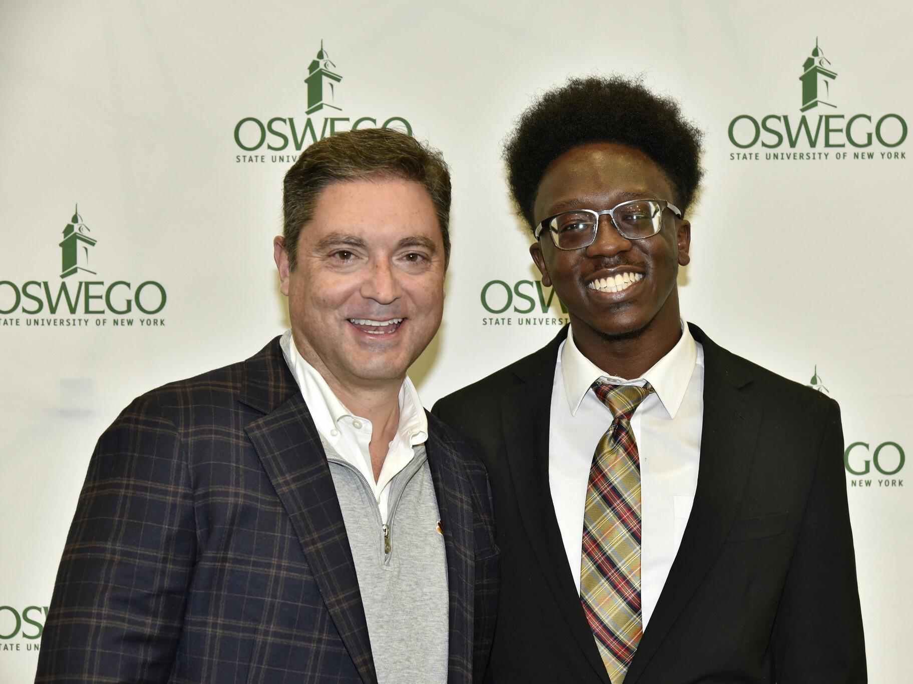 A recipient of the Tom Winiarski ’91 Scholarship, Michael Jean, is shown with Winiarski, the namesake donor. 