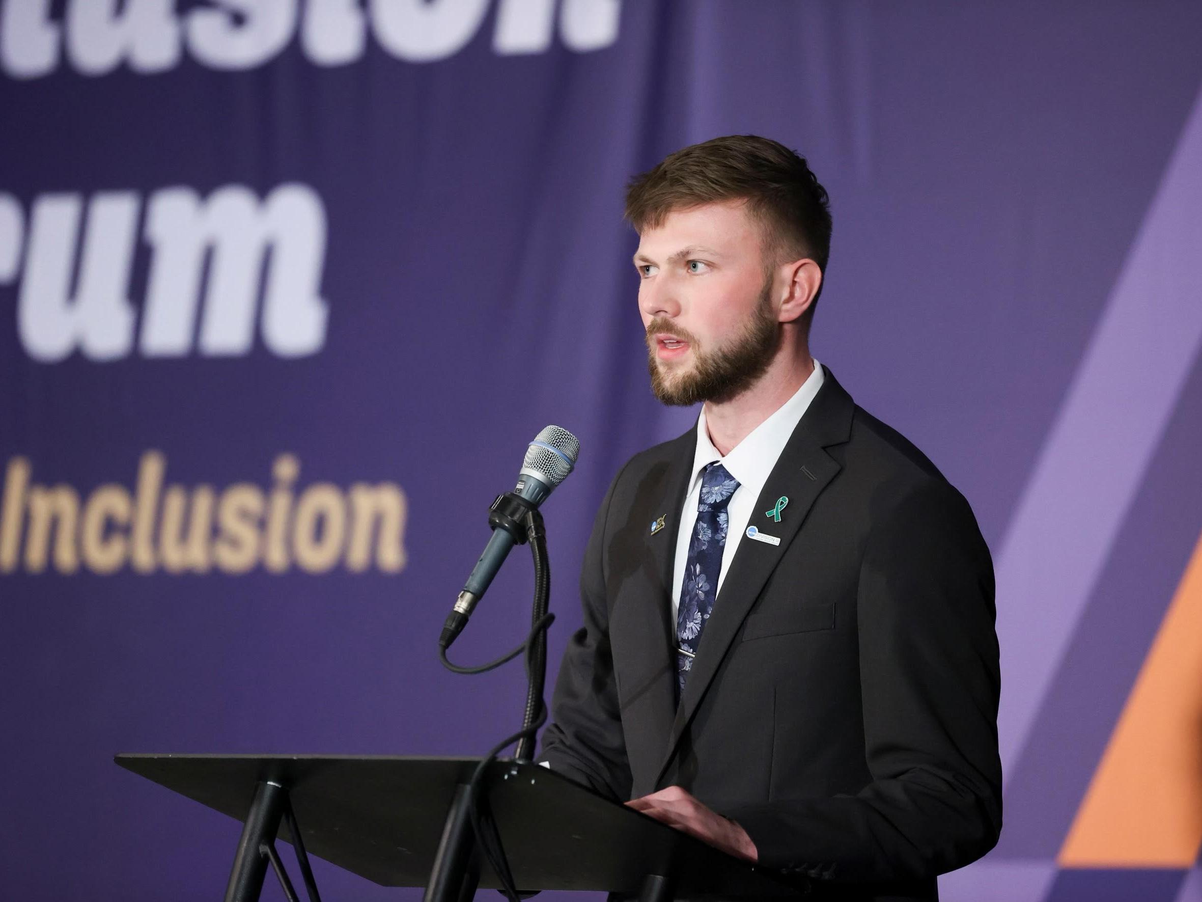 Caleb Munski speaks at the NCAA Inclusion Forum