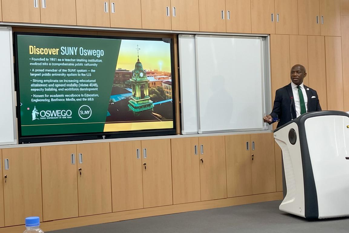 resident Nwosu makes a presentation at the University of Rwanda.
