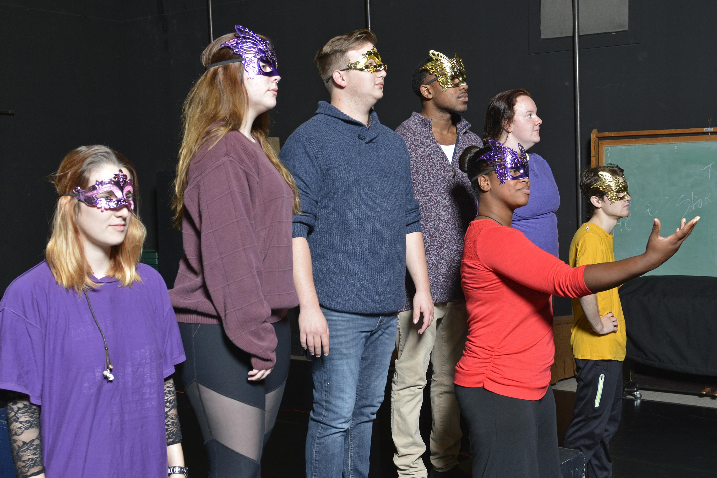 Students in "Acting Shakespeare" class in masks and rehearsing