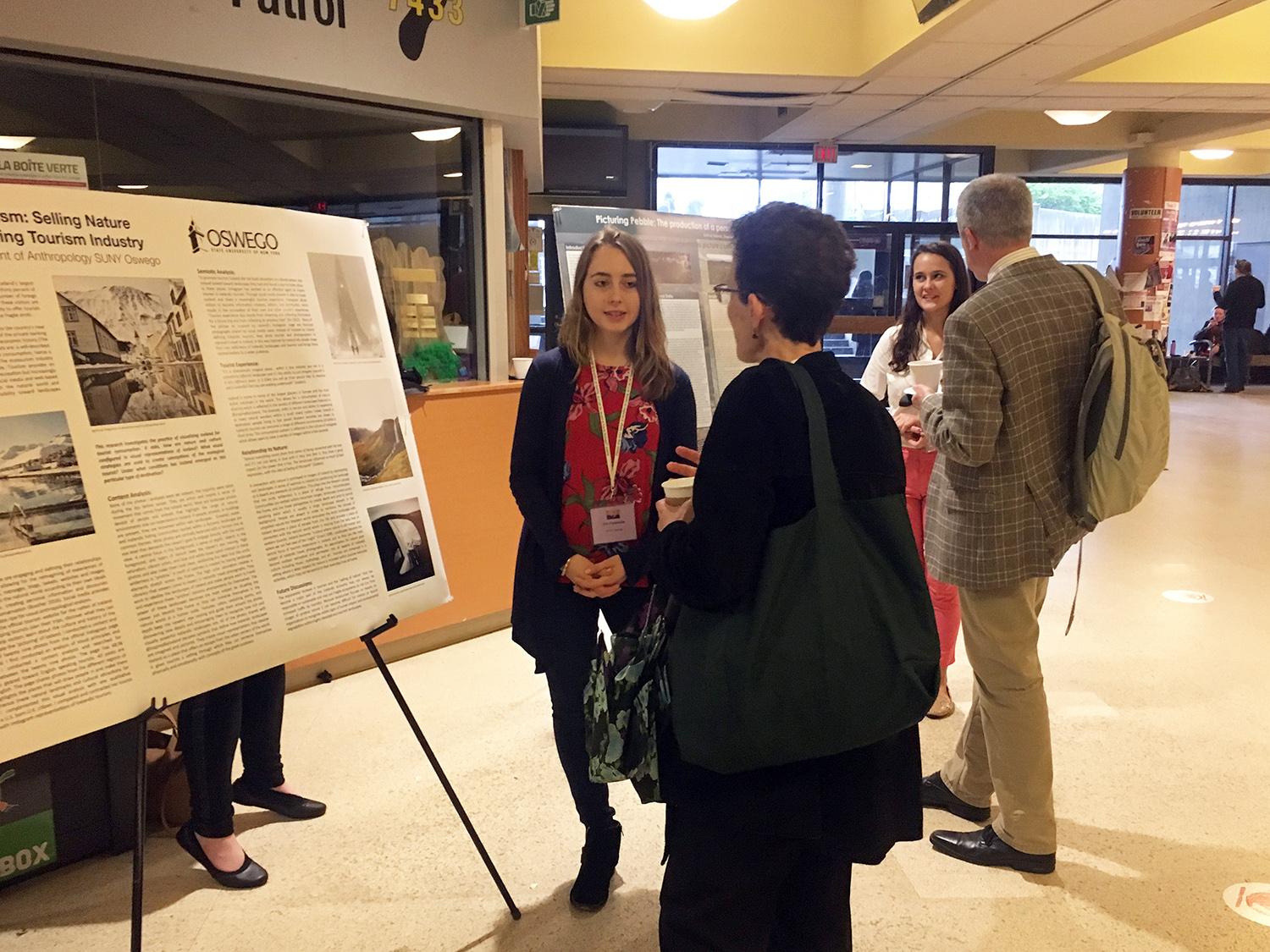 Students discussing posters