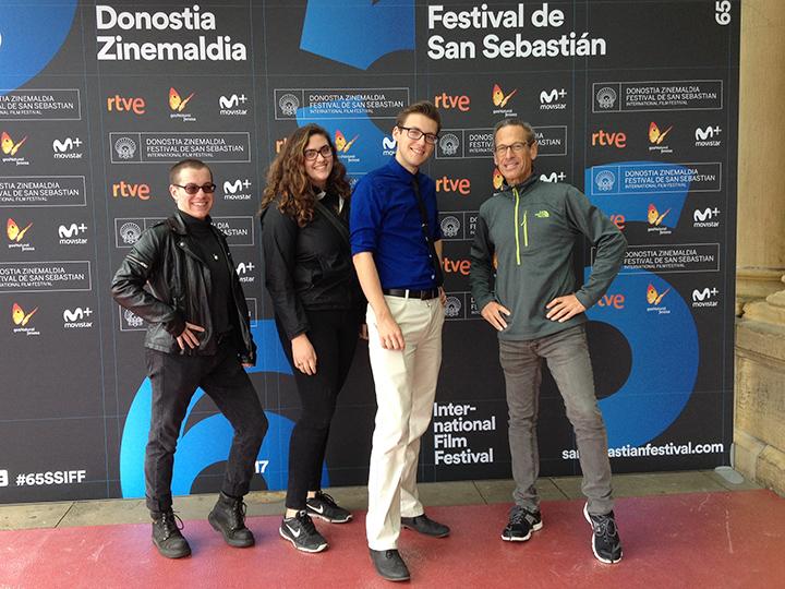 Three students and a faculty member at film conference