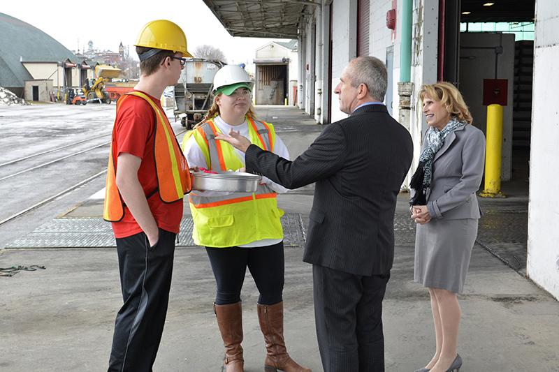 President Stanley with port director and students