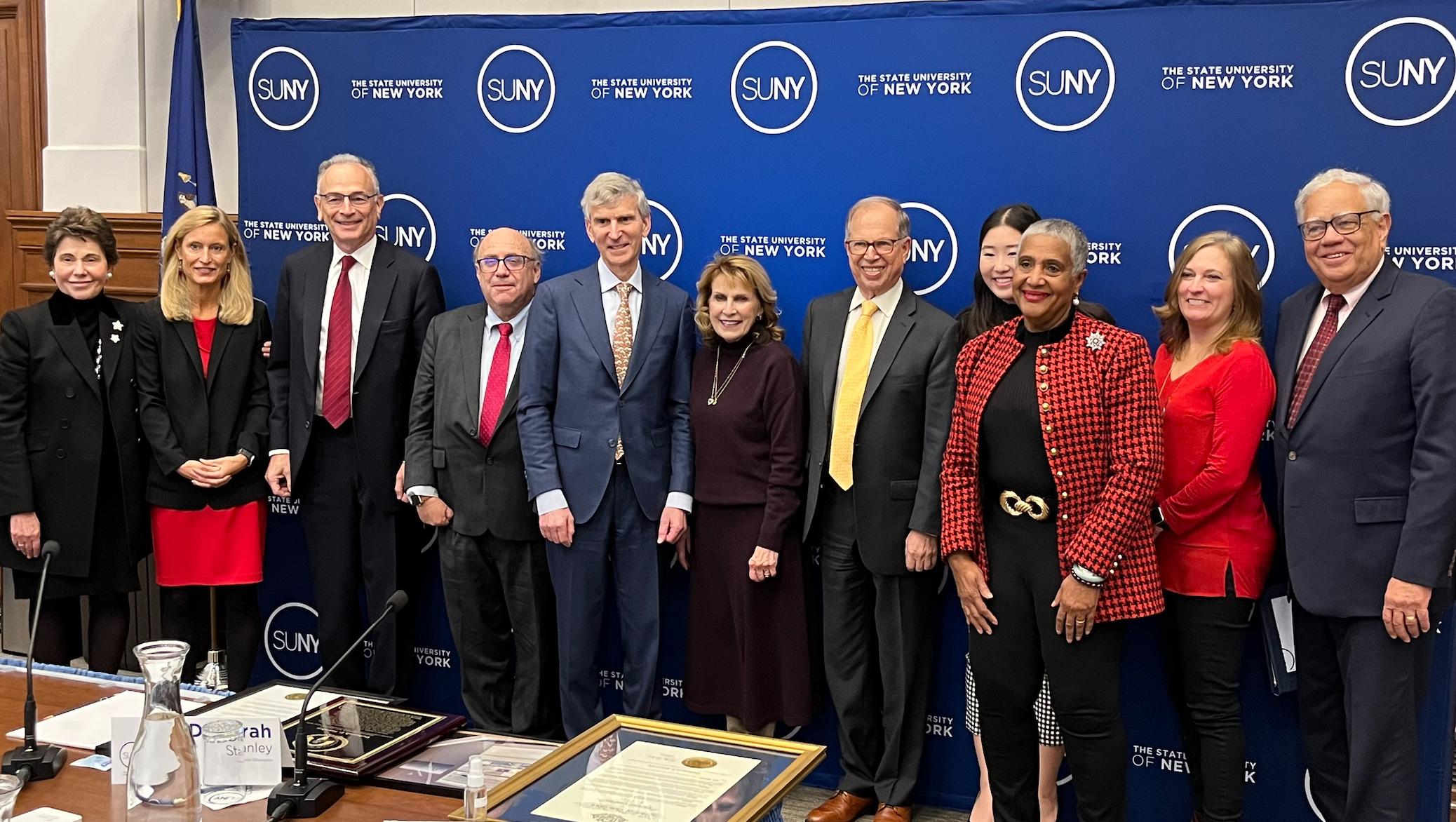 Interim SUNY Chancellor Deborah F. Stanley is surrounded by SUNY Board of Trustees after she was honored and appointed President Emeritus of SUNY Oswego at the Trustees Dec. 13, 2022 meeting in Albany.