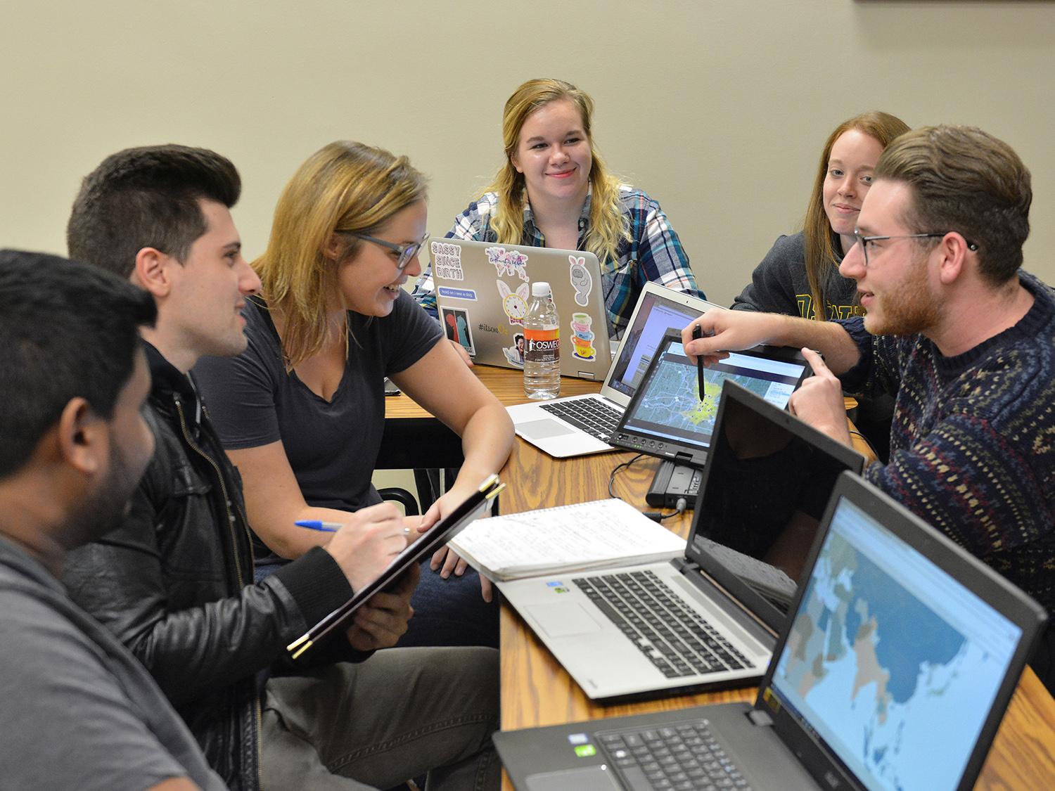 Students discuss a class project