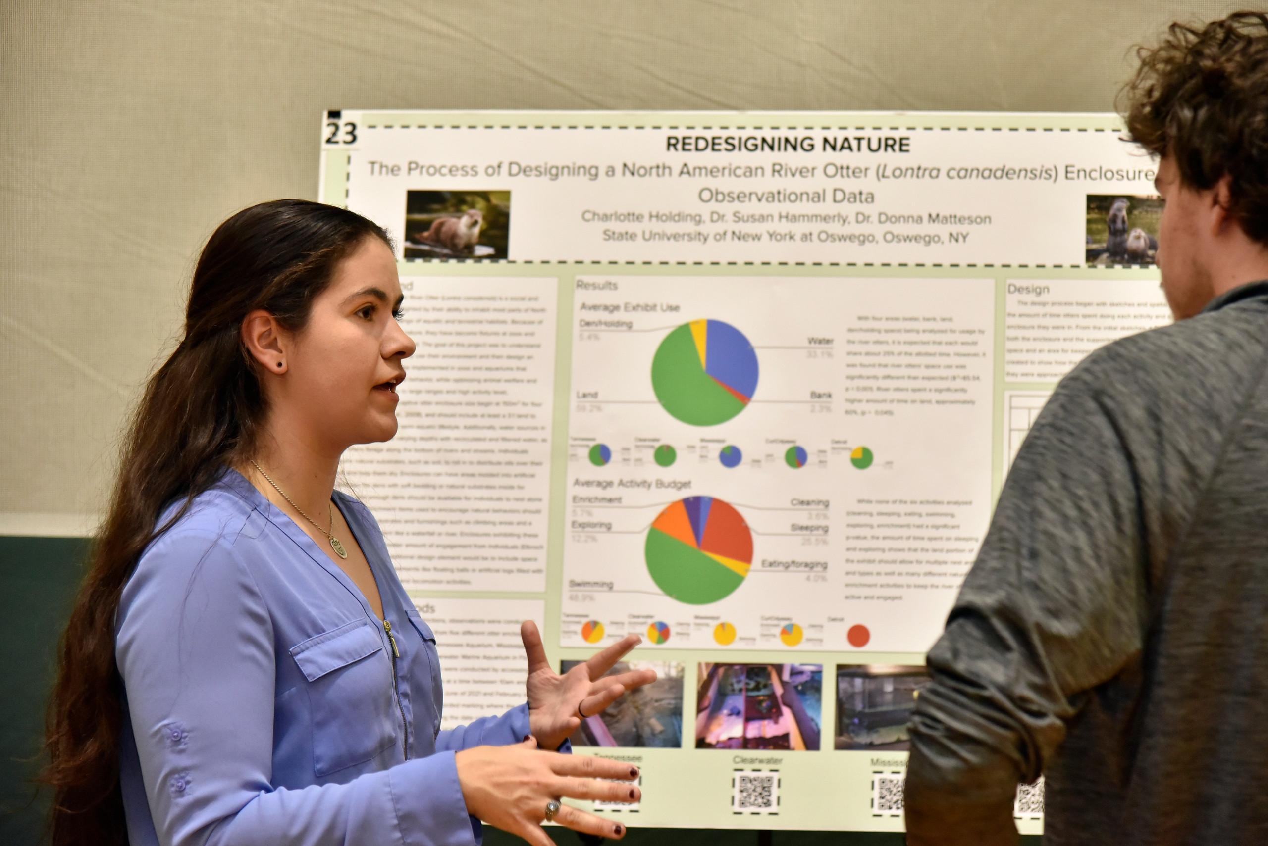 Students present research posters at the annual Quest event