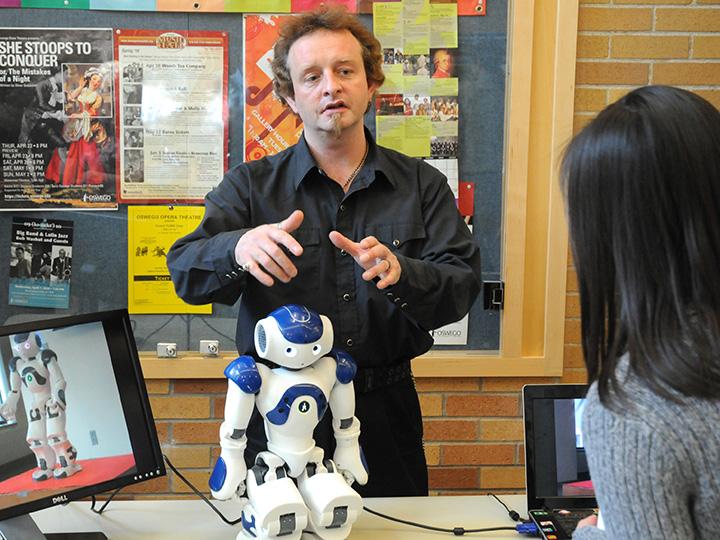 Damian Schofield with a robot