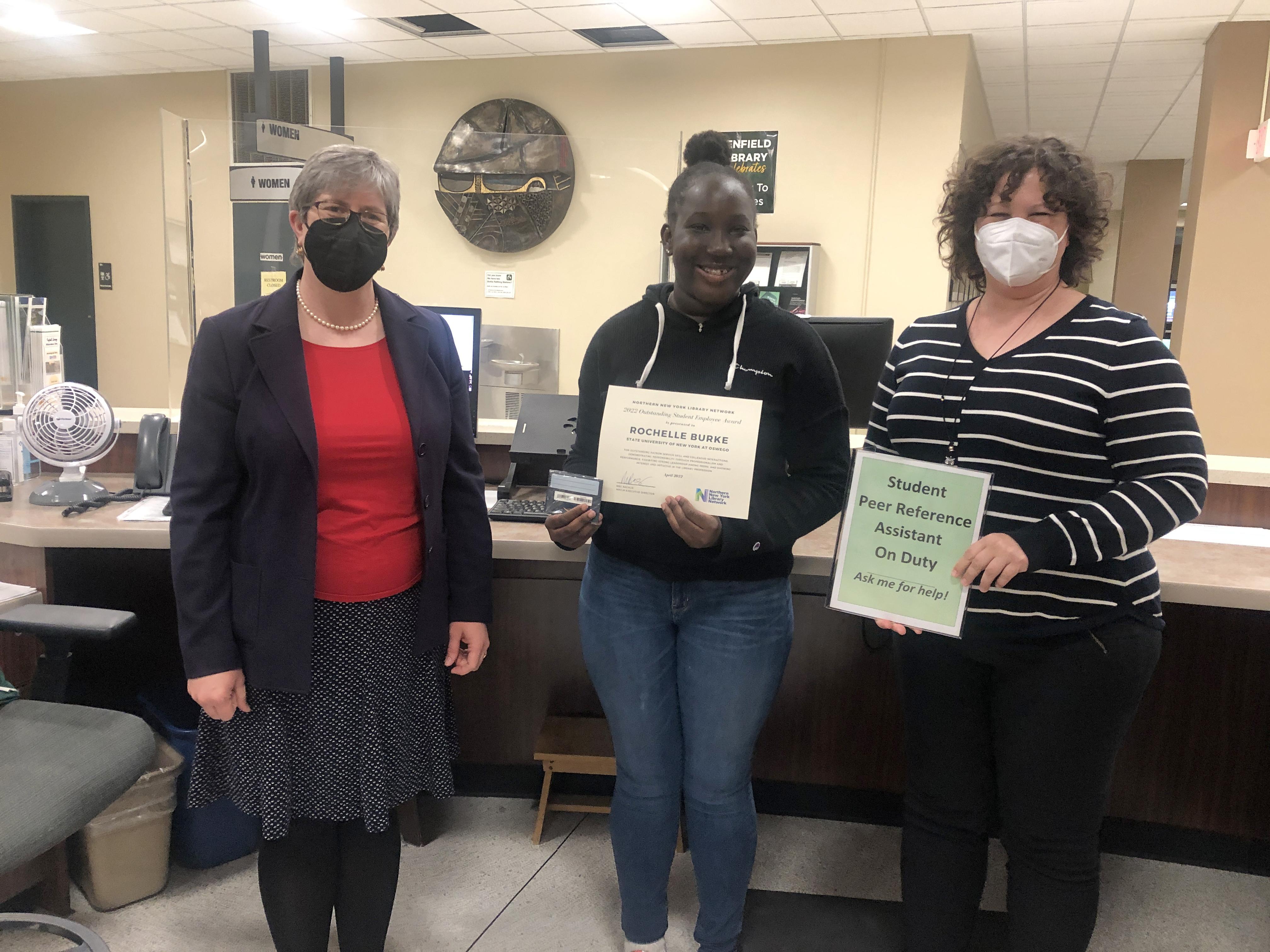 Rochelle Burke congratulated by librarians for award