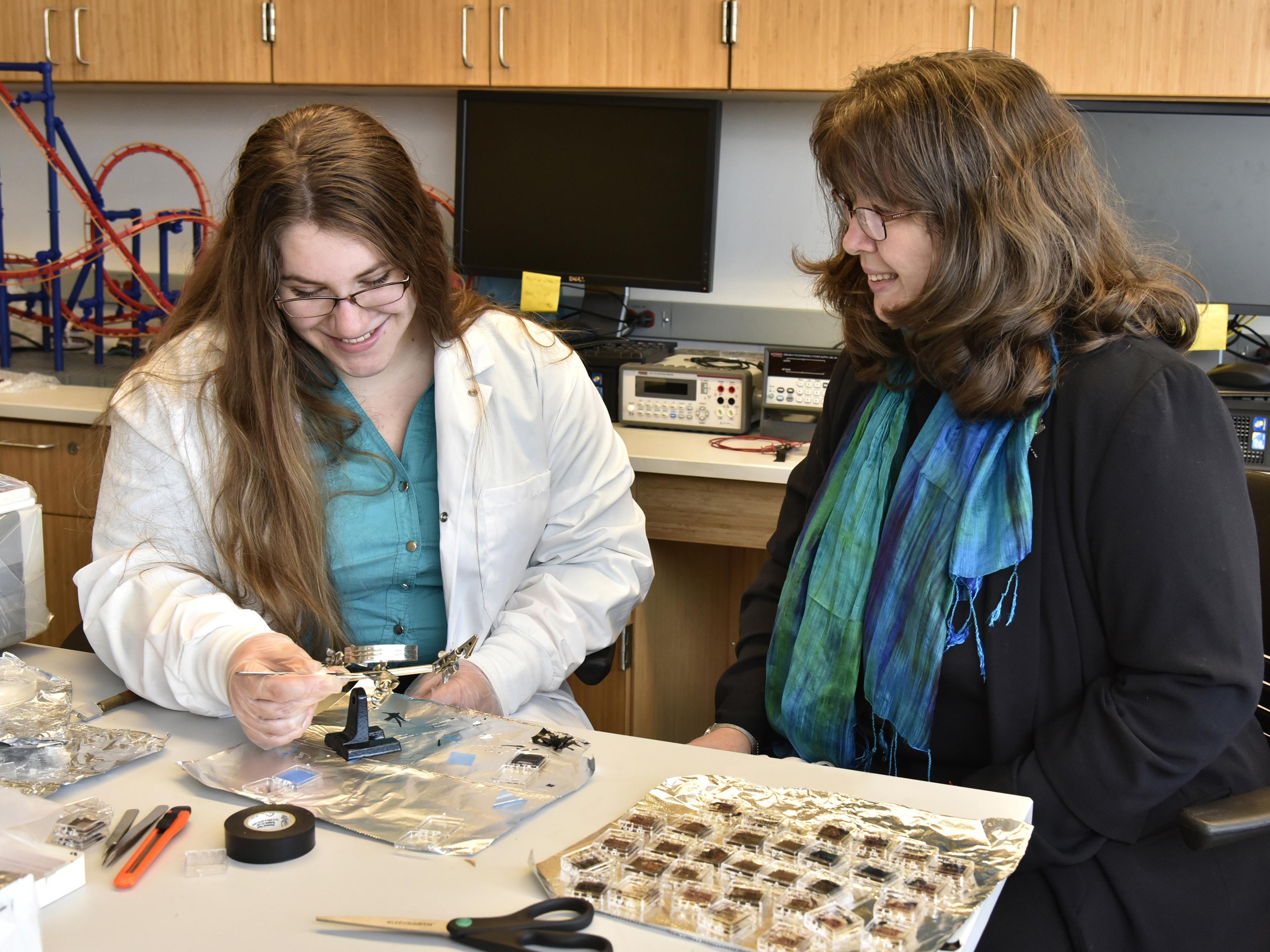 Lauren Samson and Carolina Ilie showing off research