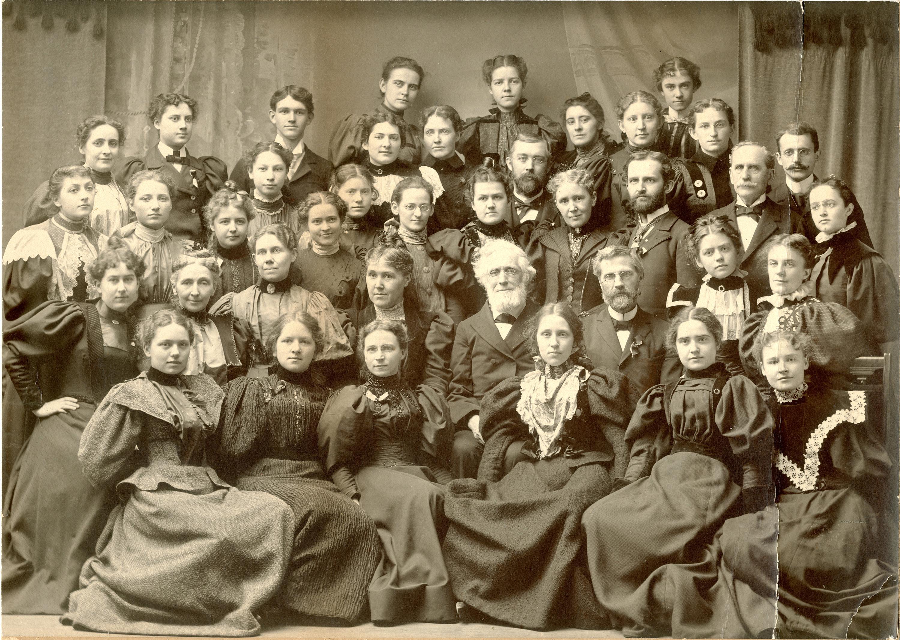 University founder Edward Austin Sheldon, surrounded by a class during the 1890s