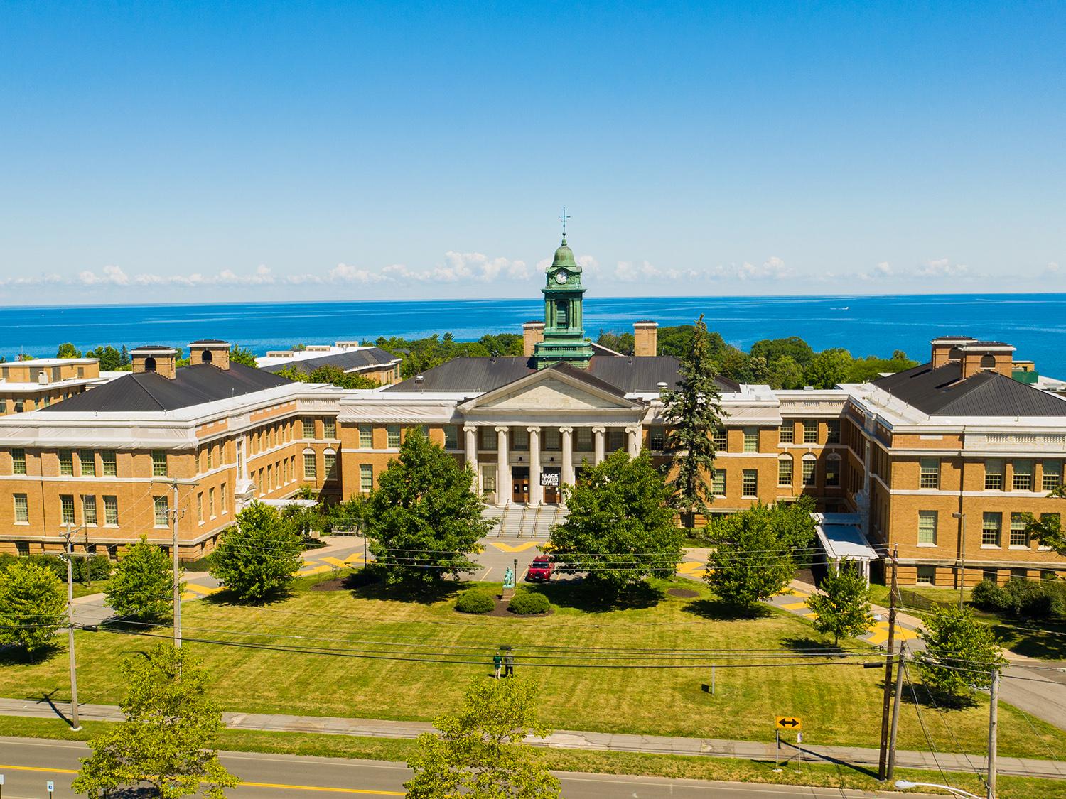 Aerial view of Sheldon Hall in front of Lake Ontario