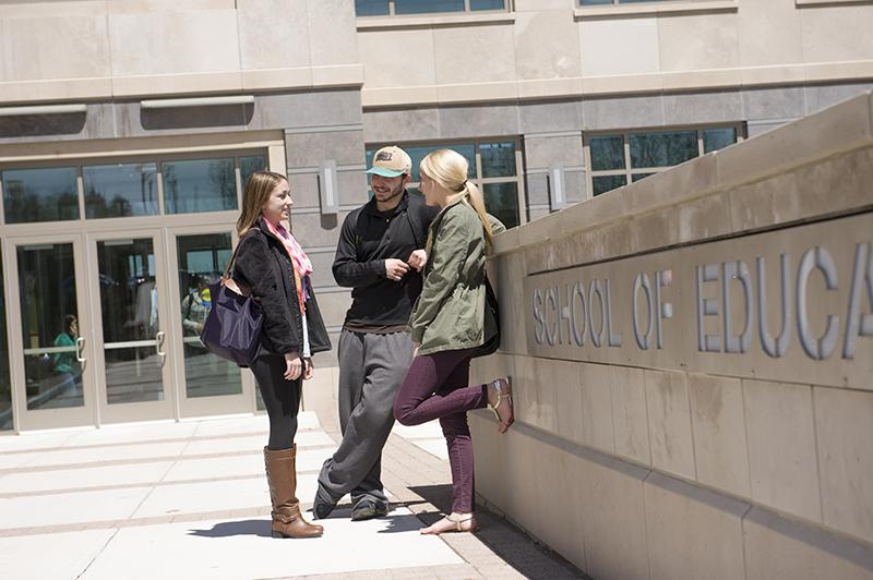 Students standing outside of the School of Education building