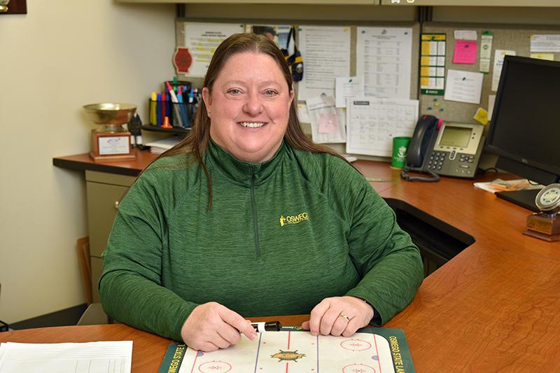 Women's hockey coach Diane Dillon and her team are active in service