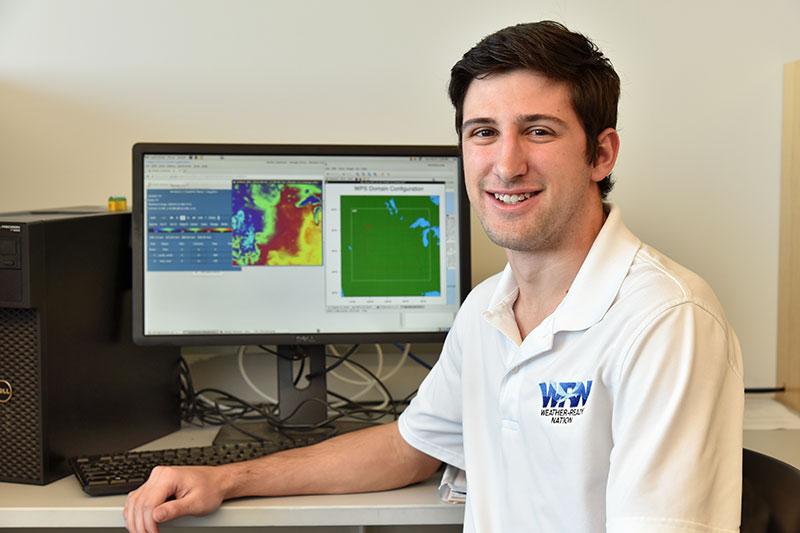 Zachary Hiris in a meteorology lab