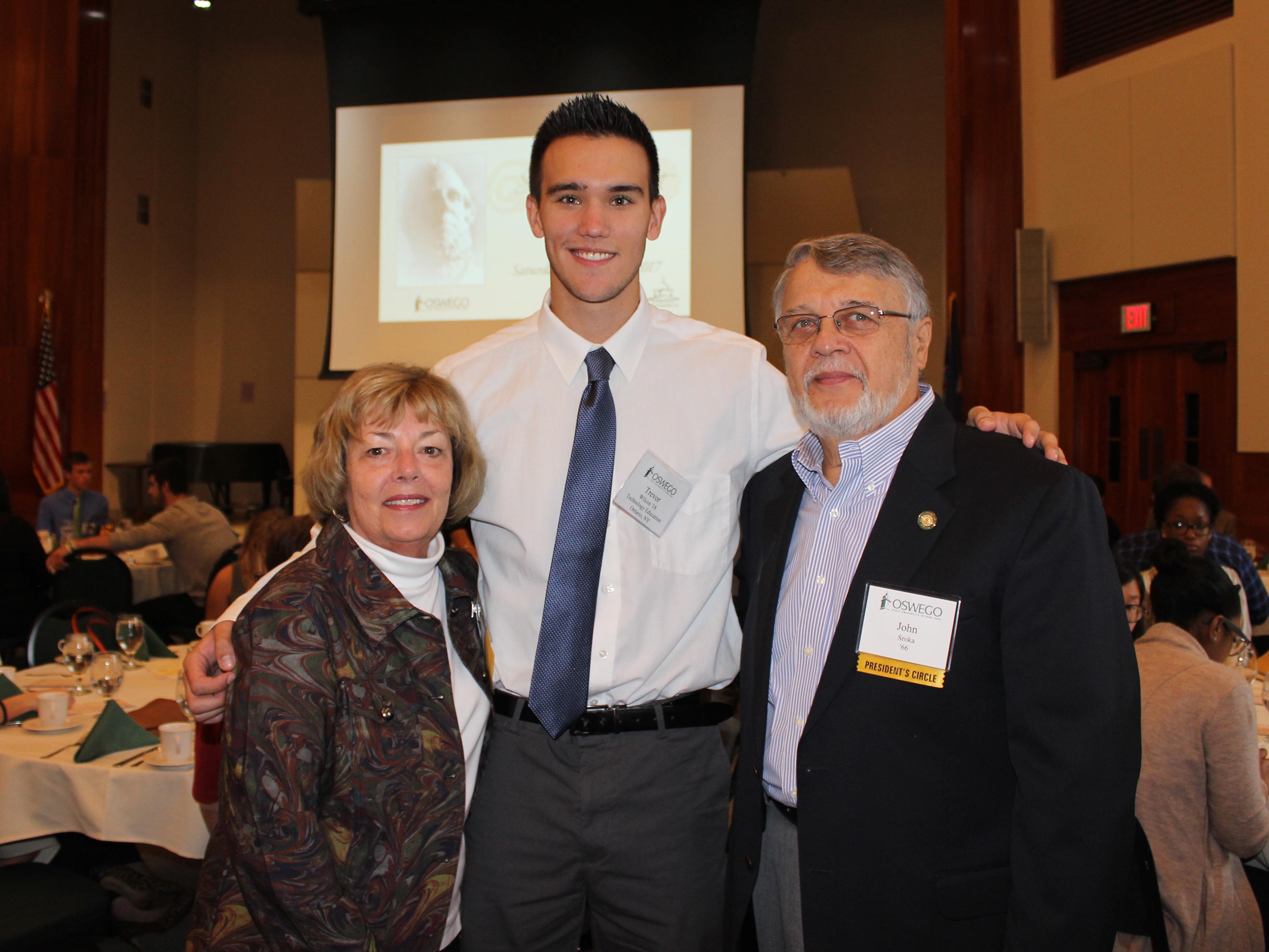 Srokas presenting scholarship to Oswego student