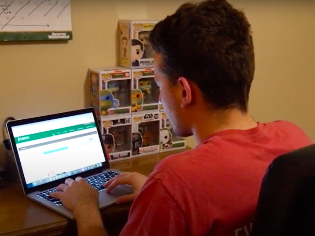 Student works on a computer in a household setting