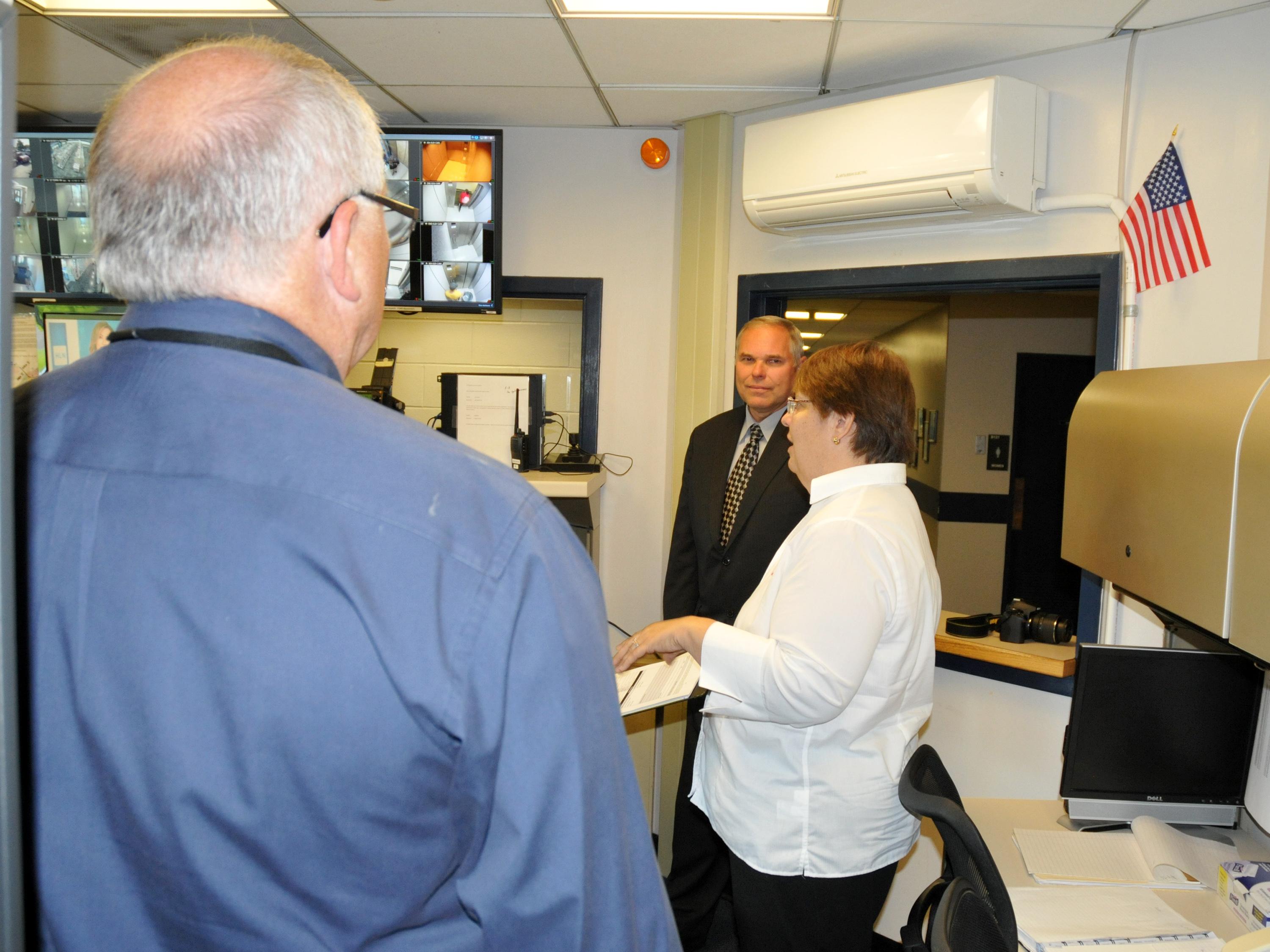 Staff from NOAA, emergency management and University Police discussing storm training